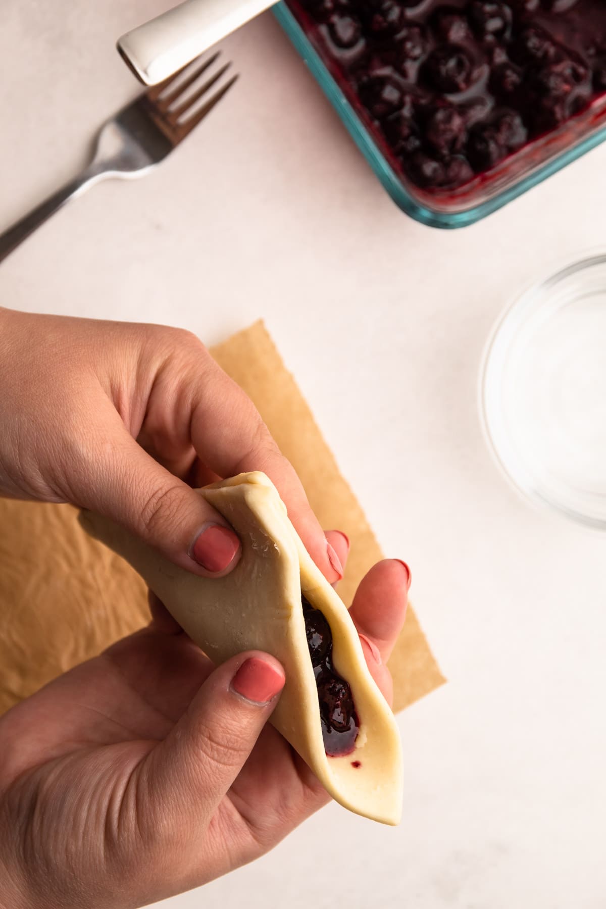 Closing up a blueberry turnover.