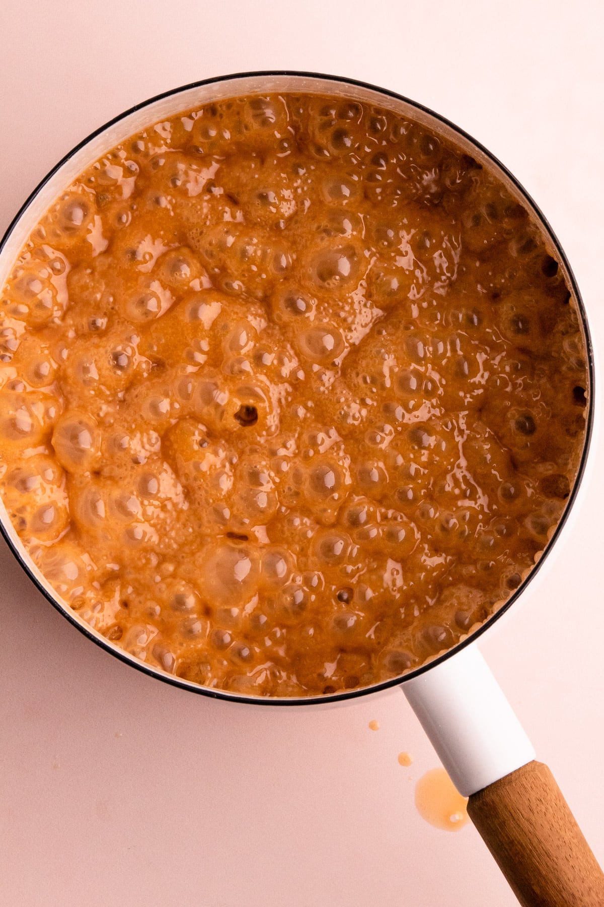 Bubbling caramel in a pot.