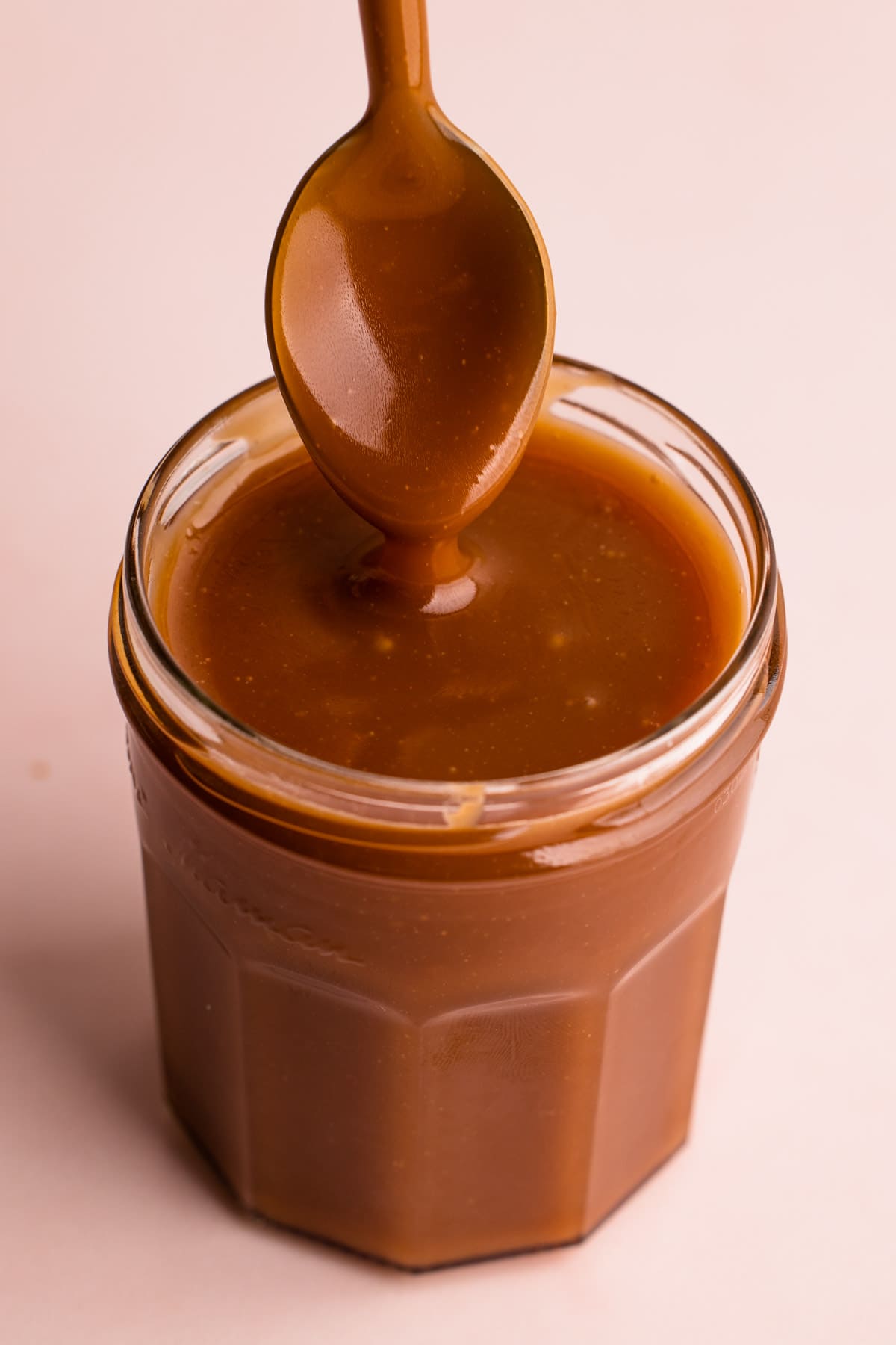 Drippy caramel in a jar.