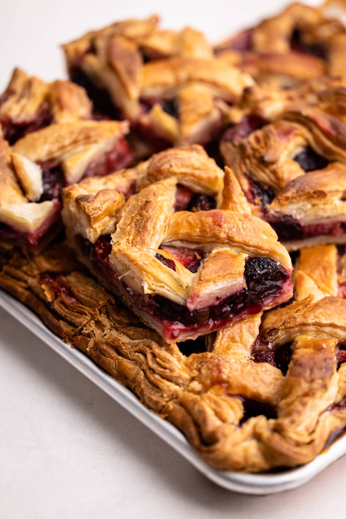 Strawberry Cherry slab Pie sliced and stacked together.