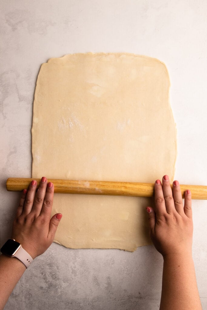 Rolling out pie crust.