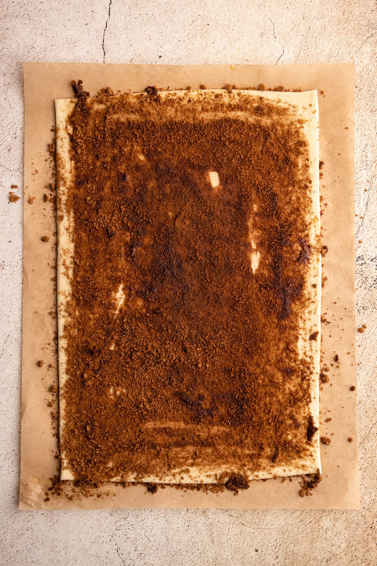 Puff pastry with cinnamon sugar sprinkled on it to make cinnamon twists.