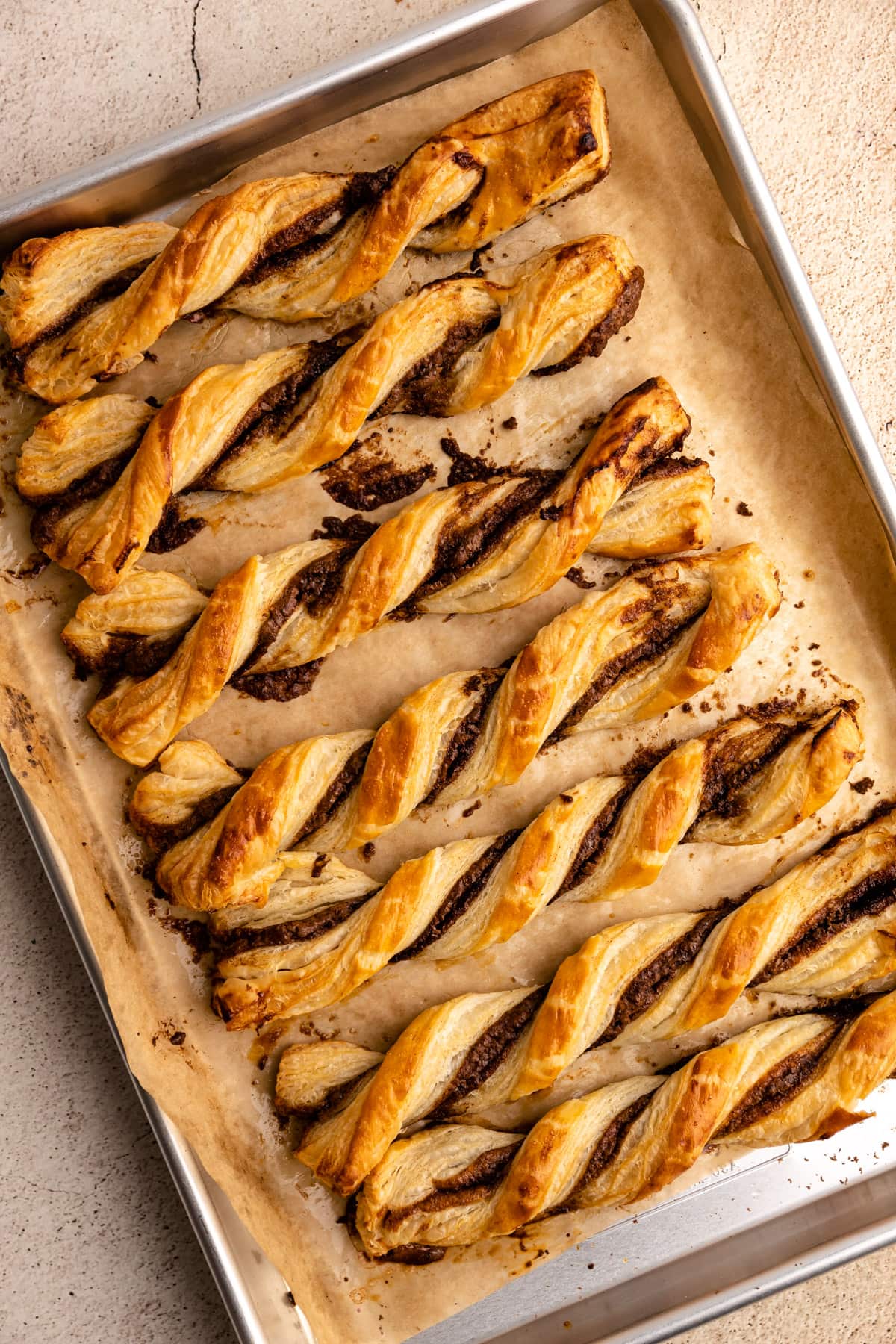 Baked cinnamon twists made from puff pastry.