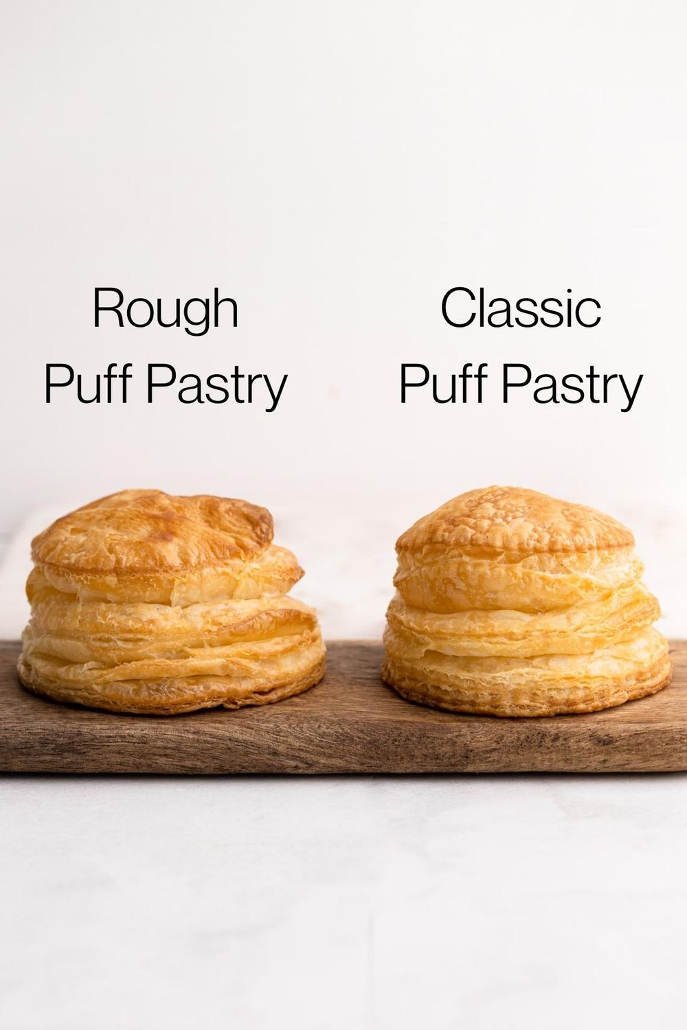 One baked classic puff pastry next to one baked piece of rough puff pastry.