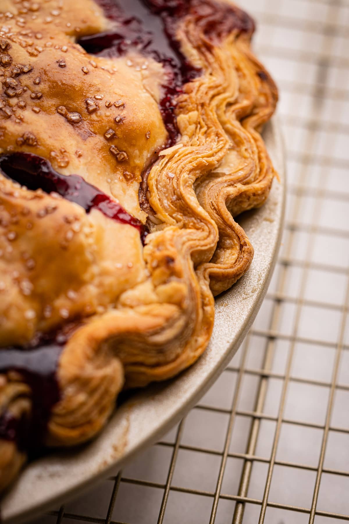 A blackberry pie baked with a super flaky pie crust.
