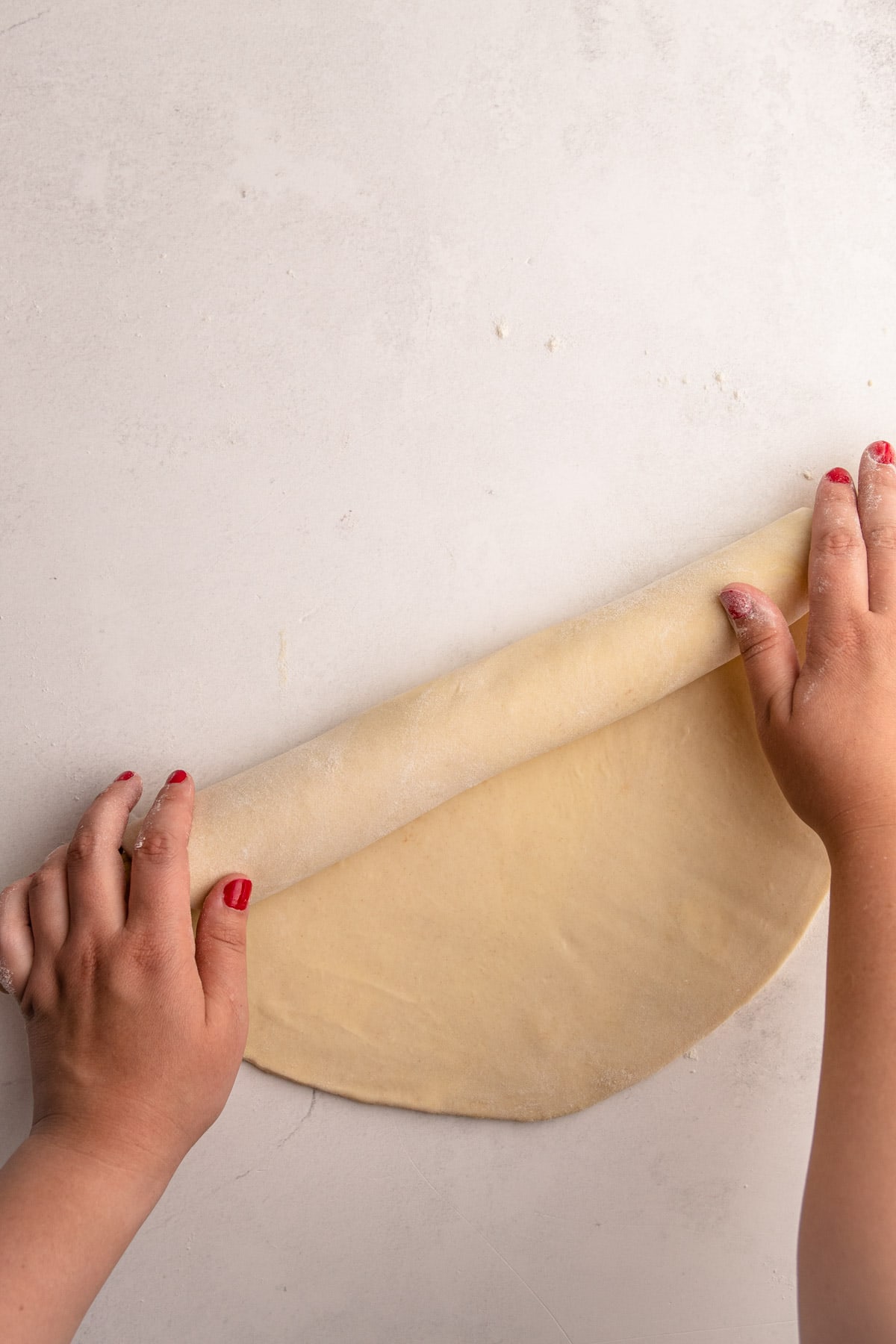 Rolling out pie crust.