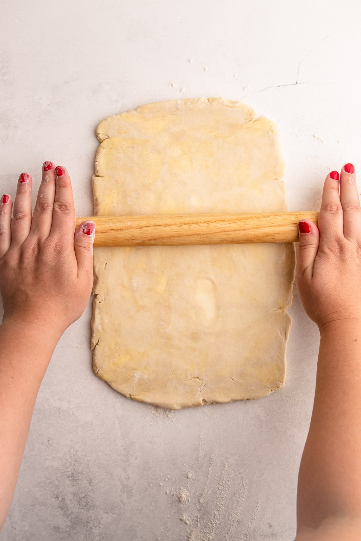 Folding flaky pie dough.