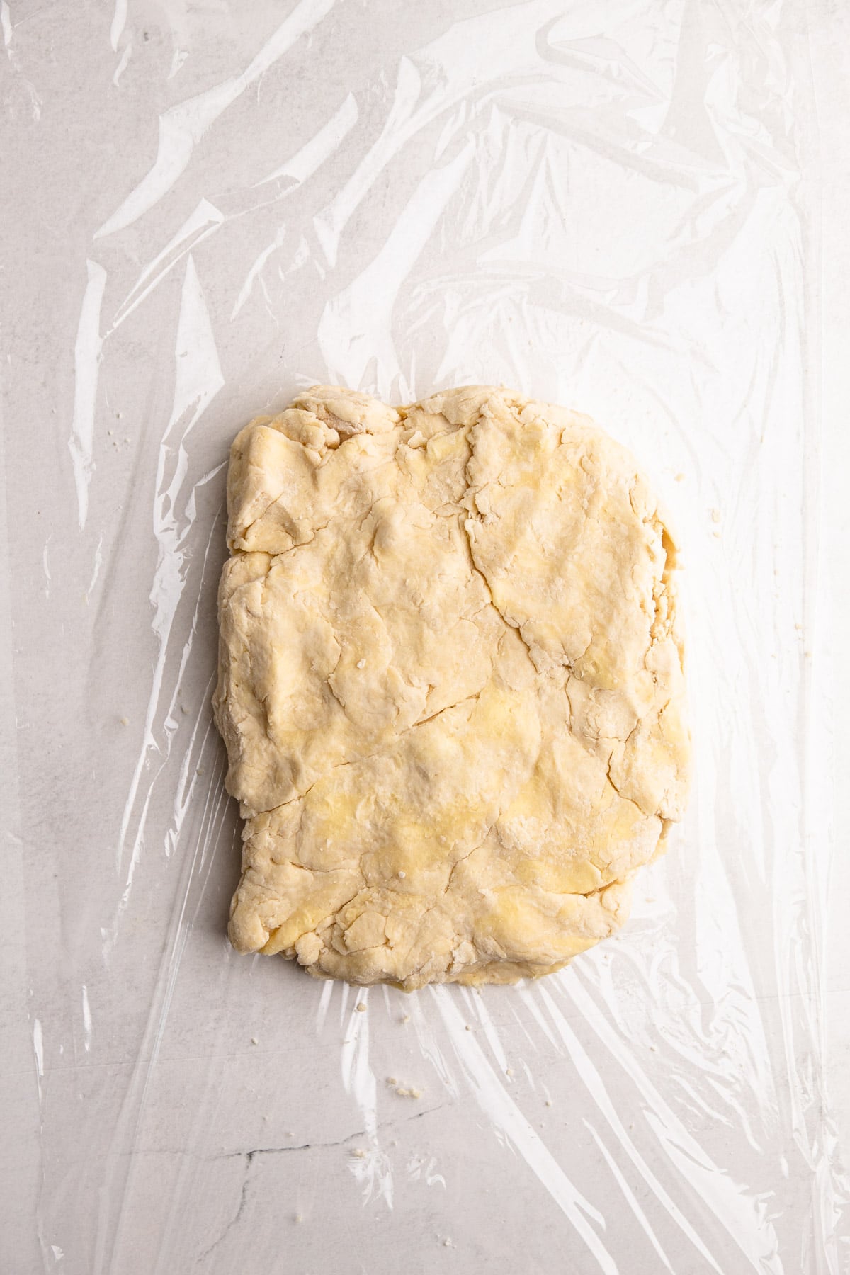 A rectangle of flaky pie dough.