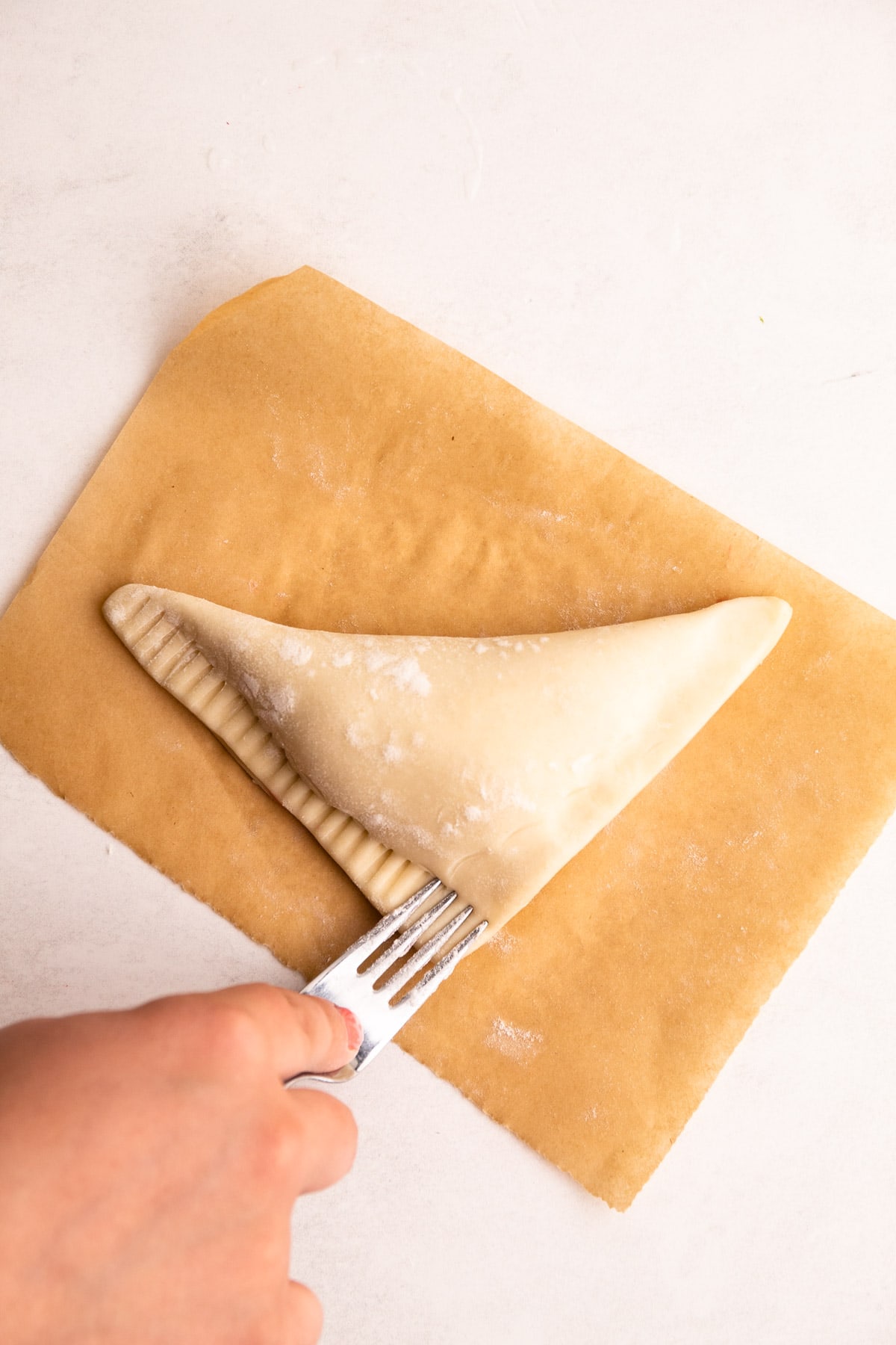 Preparing an apple turnover.