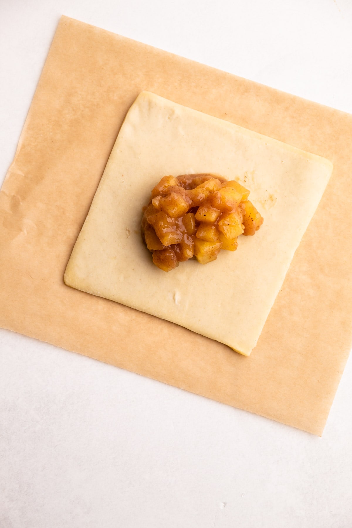 Preparing an apple turnover.