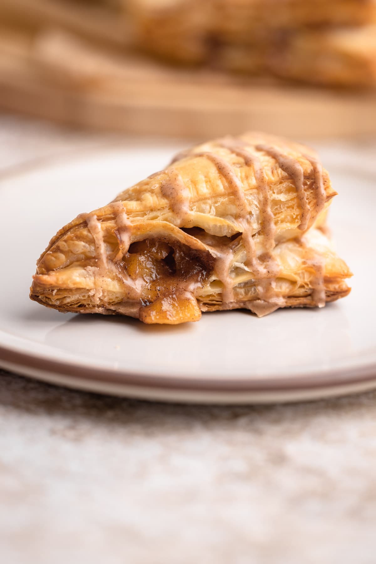 An apple turnover on a plate.