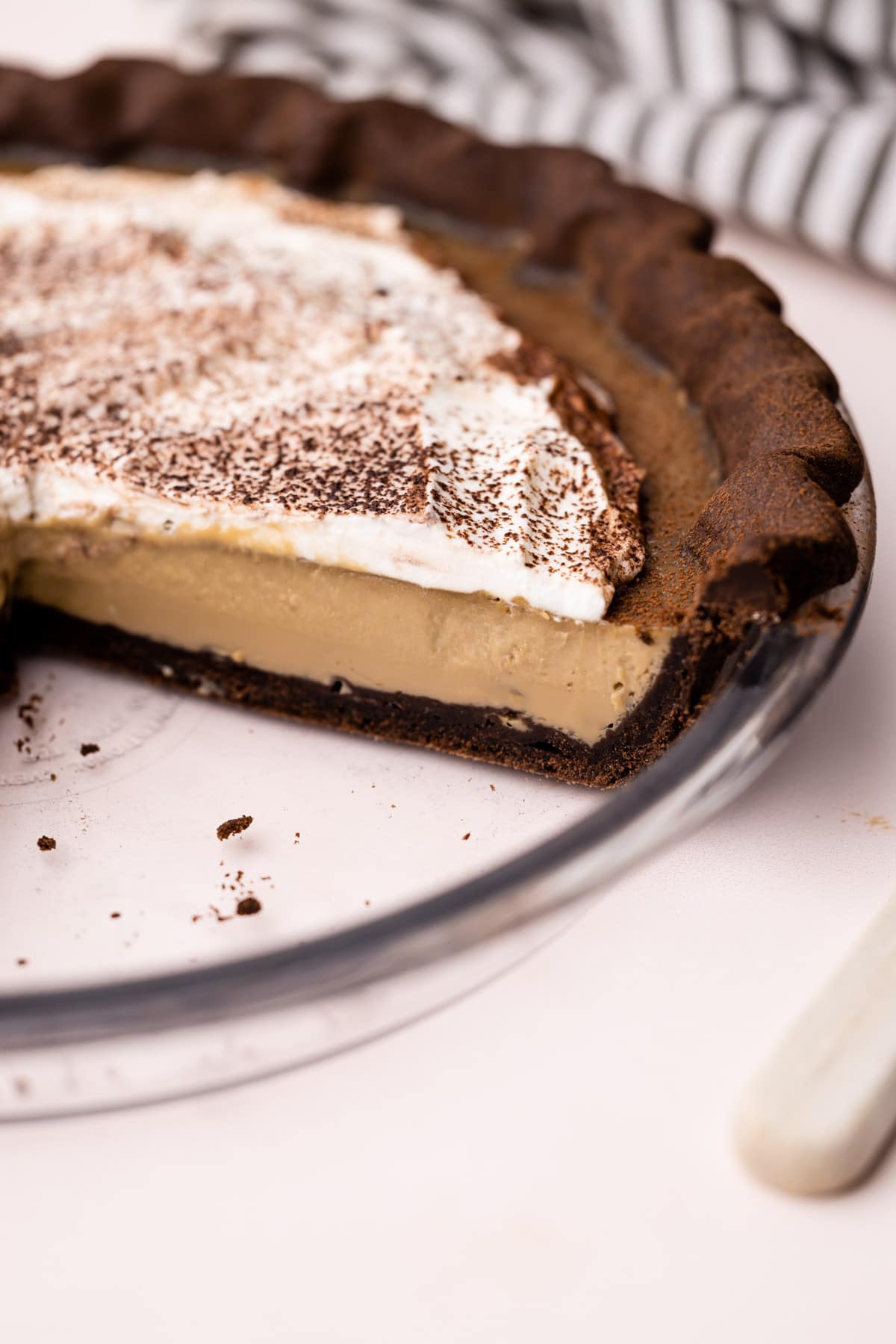 Sliced coffee custard pie with chocolate crust.