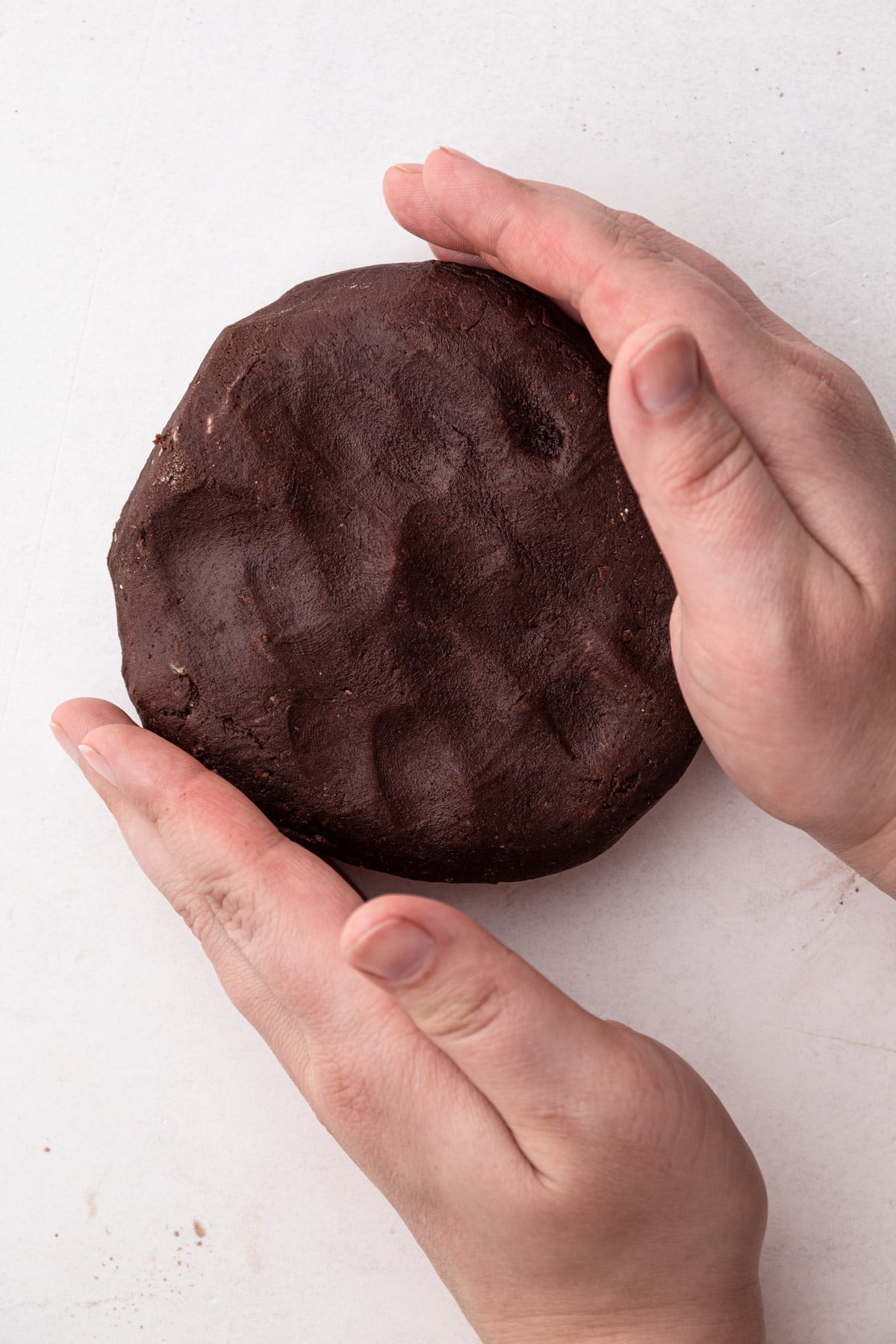 A ball of chocolate pie crust.