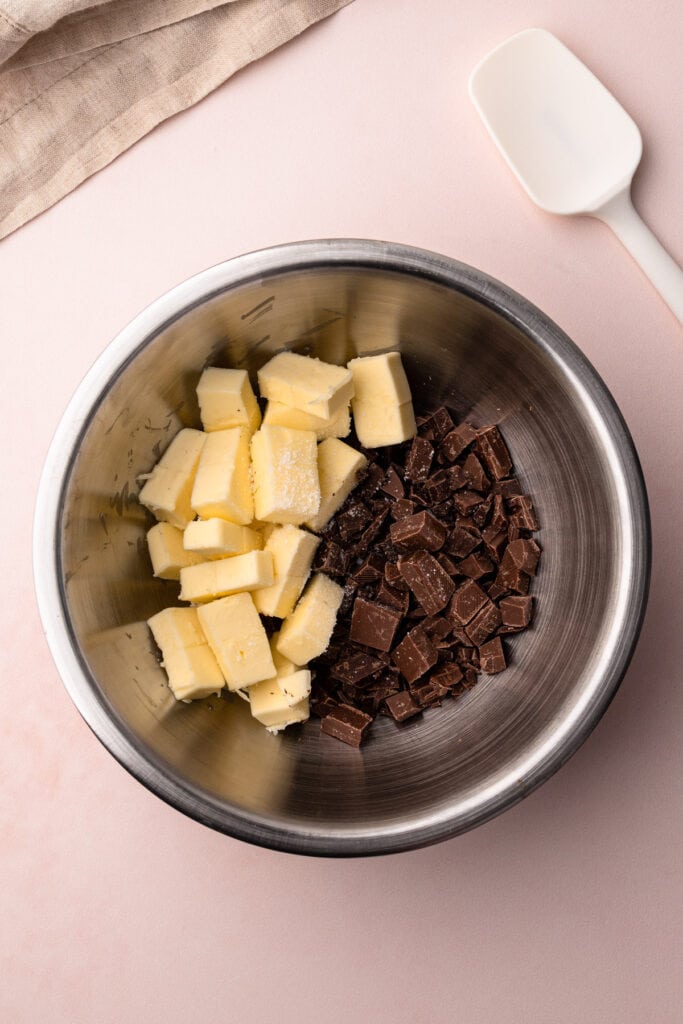 Butter and chocolate in a metal bowl.