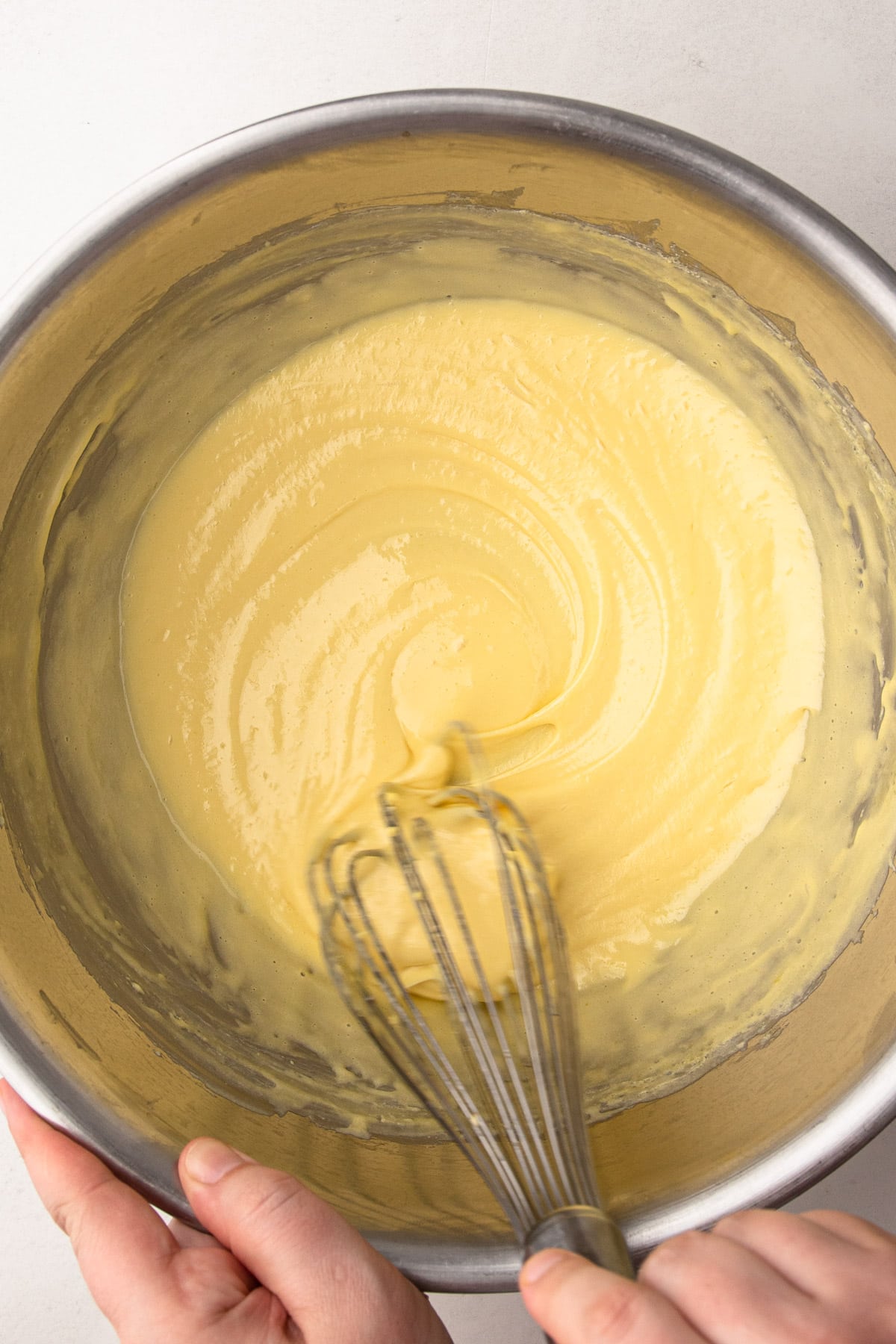 Cooked eggs and sugar in a bowl for French silk pie.