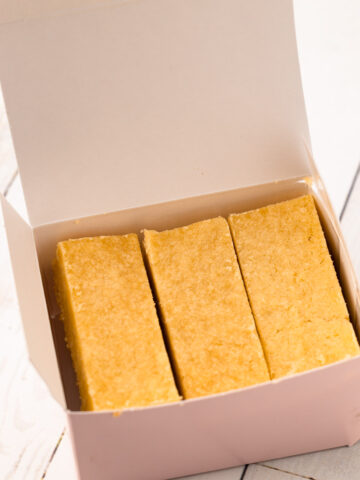 A pink box with Ted Lasso biscuits.