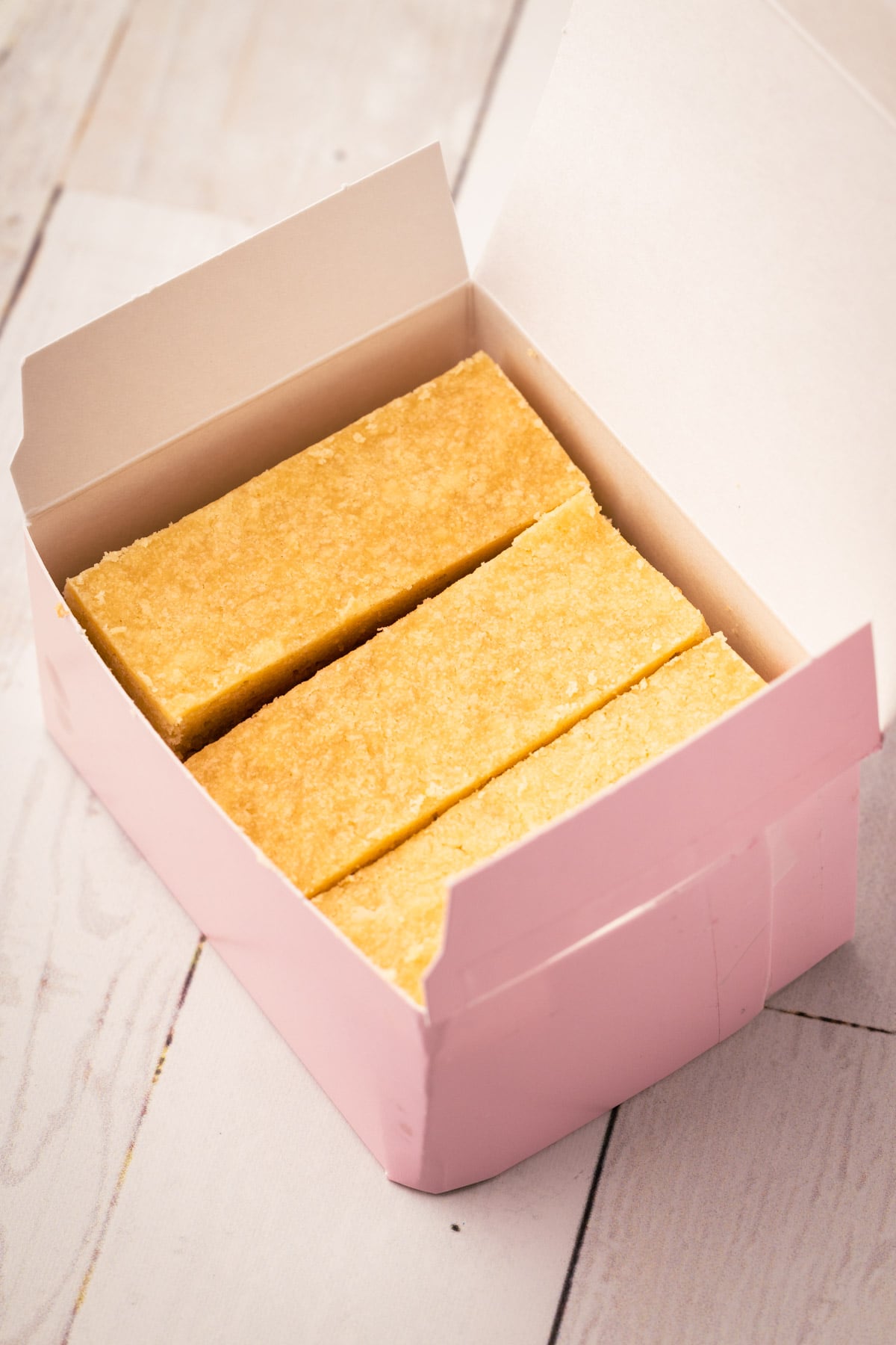 A little pink box with shortbread biscuits in them just like Biscuits with the box in Ted Lasso.