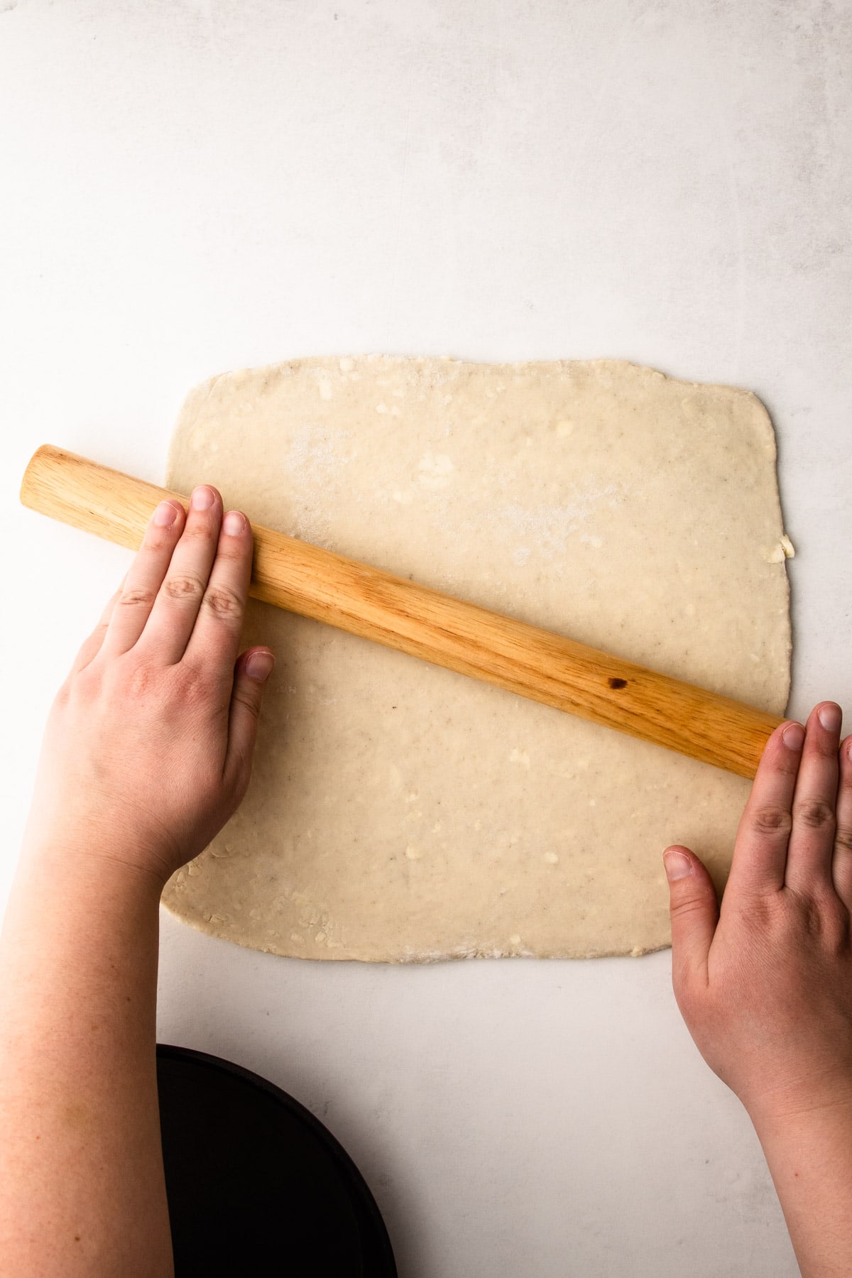 Rolling out puff pastry.