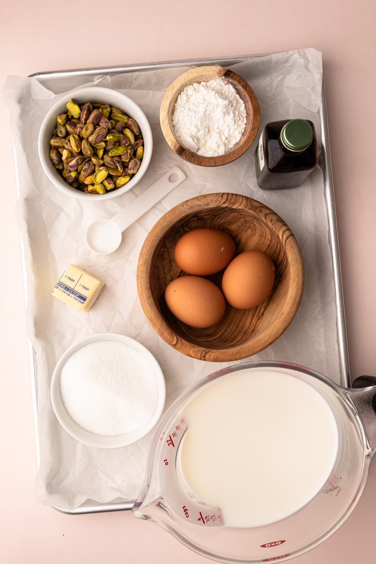 Ingredients for pistachio pudding on a tray.