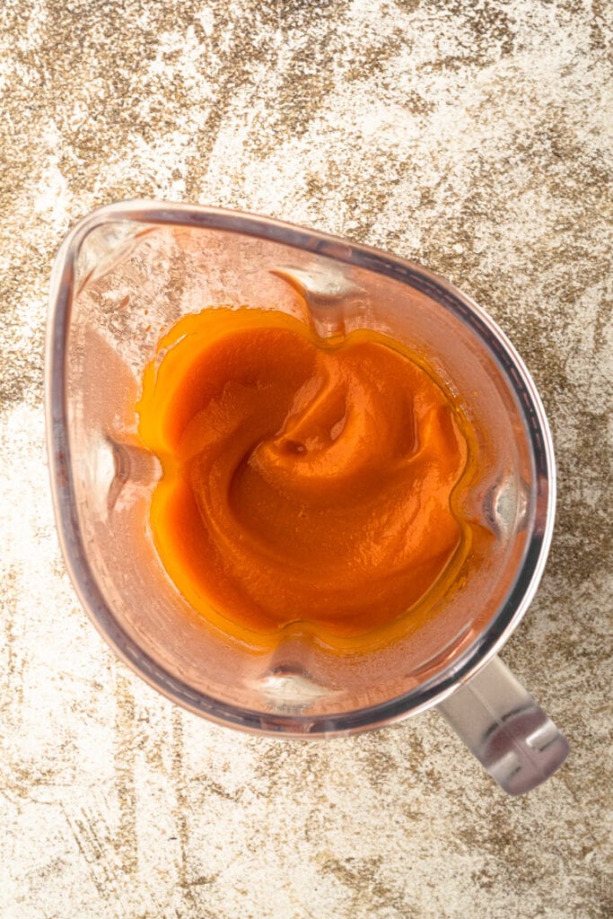 Pureed carrots in a blender for carrot pie.