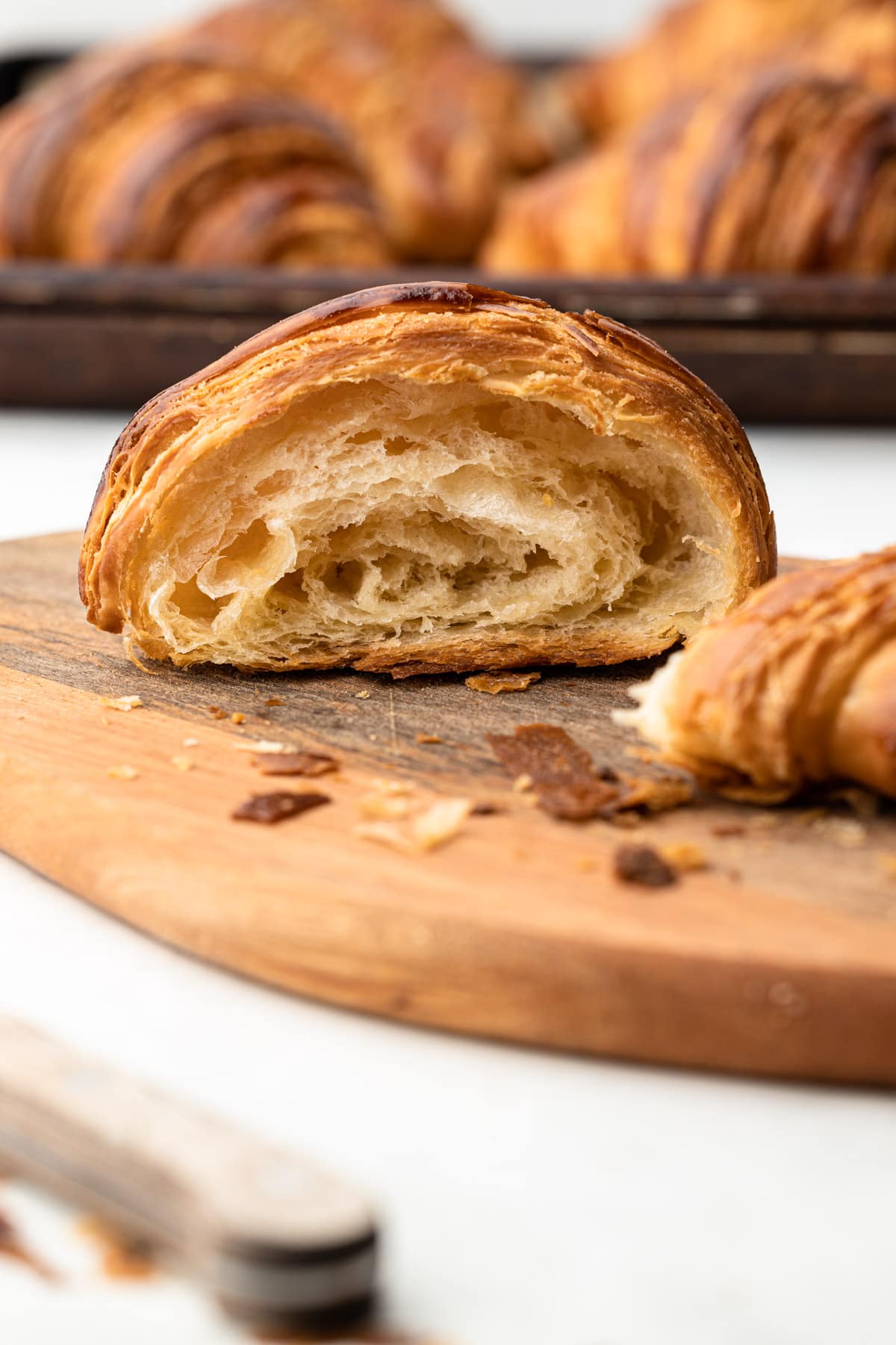 A half eaten homebaked croissant.