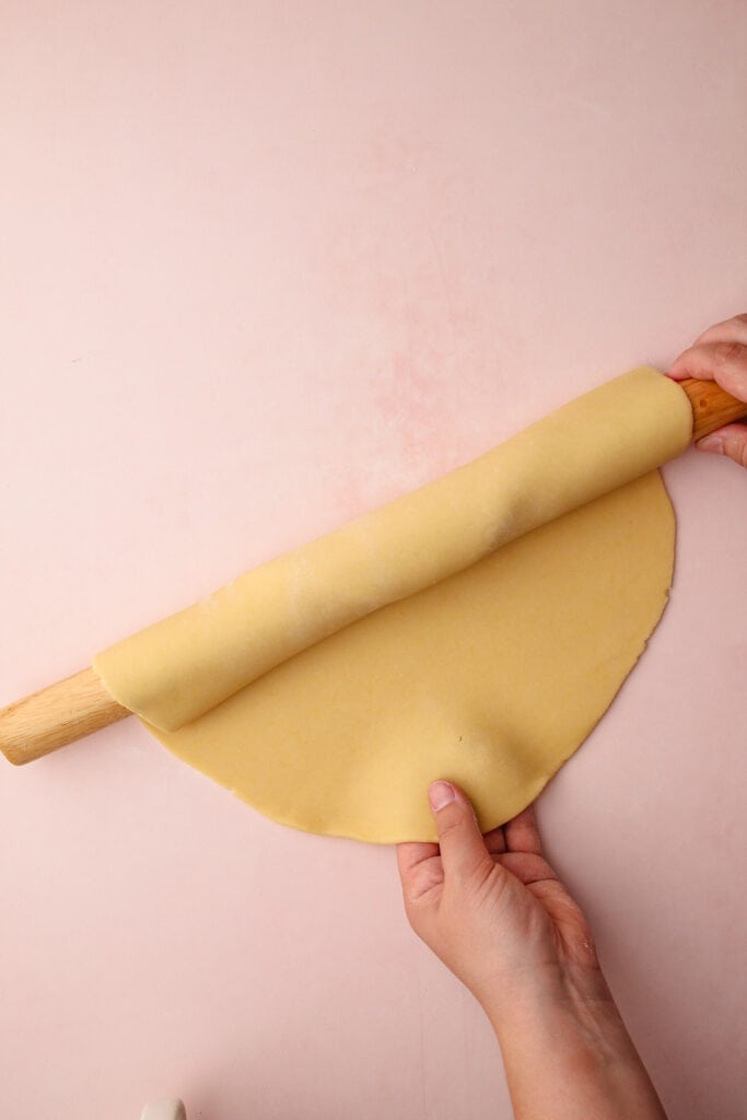 Rolling out pie crust.