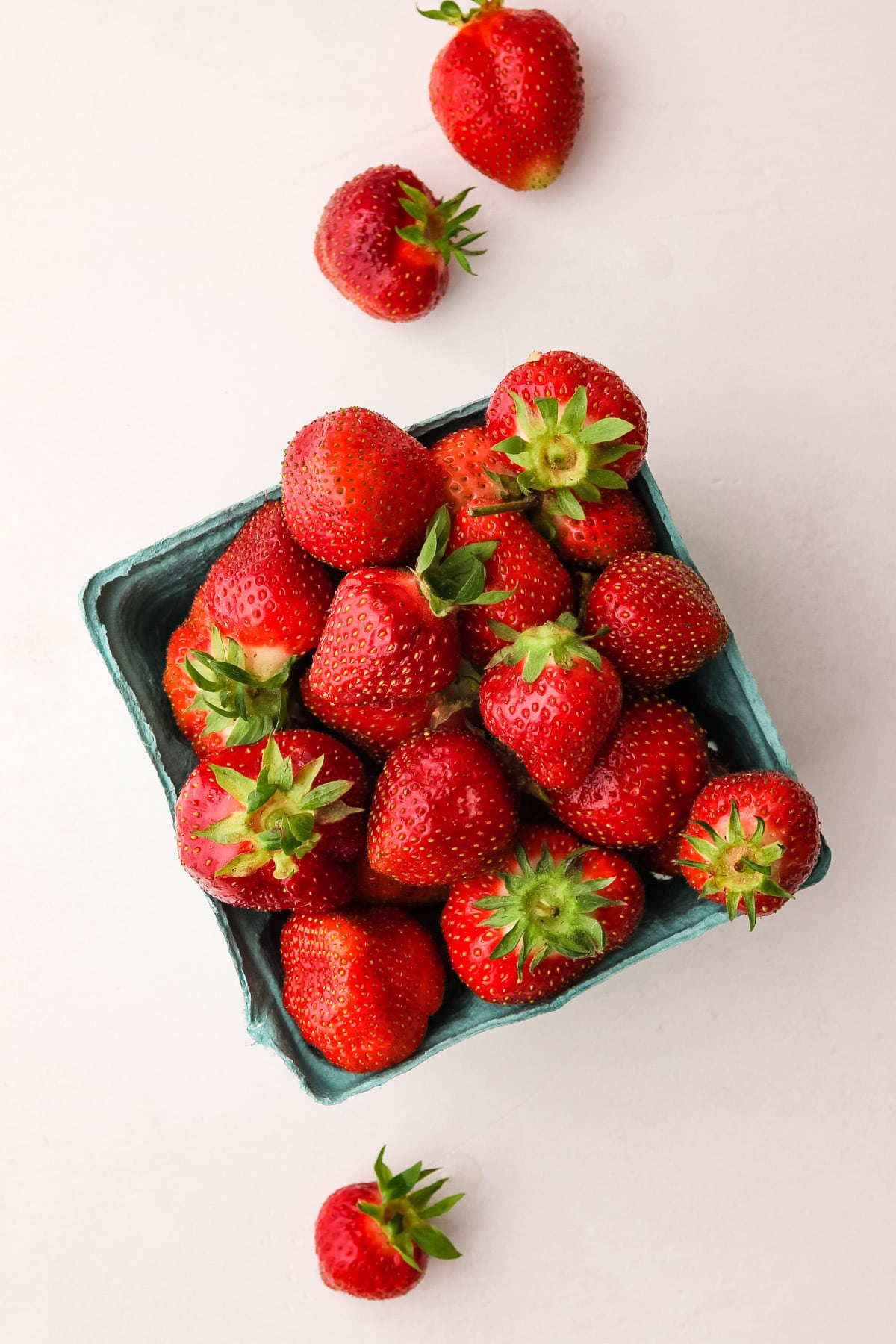 A basket of ripe strawberries.