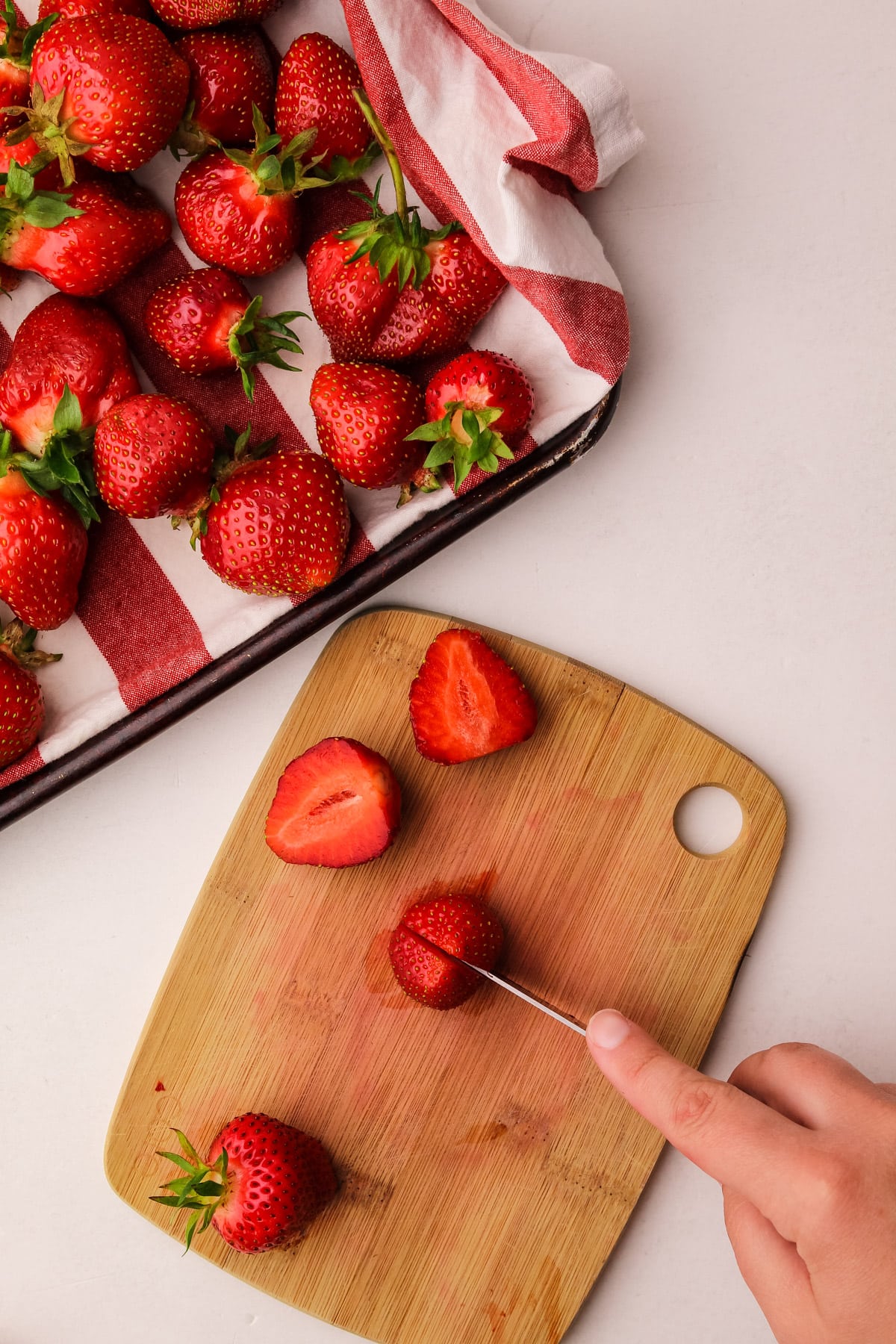 Slicing strawberries.