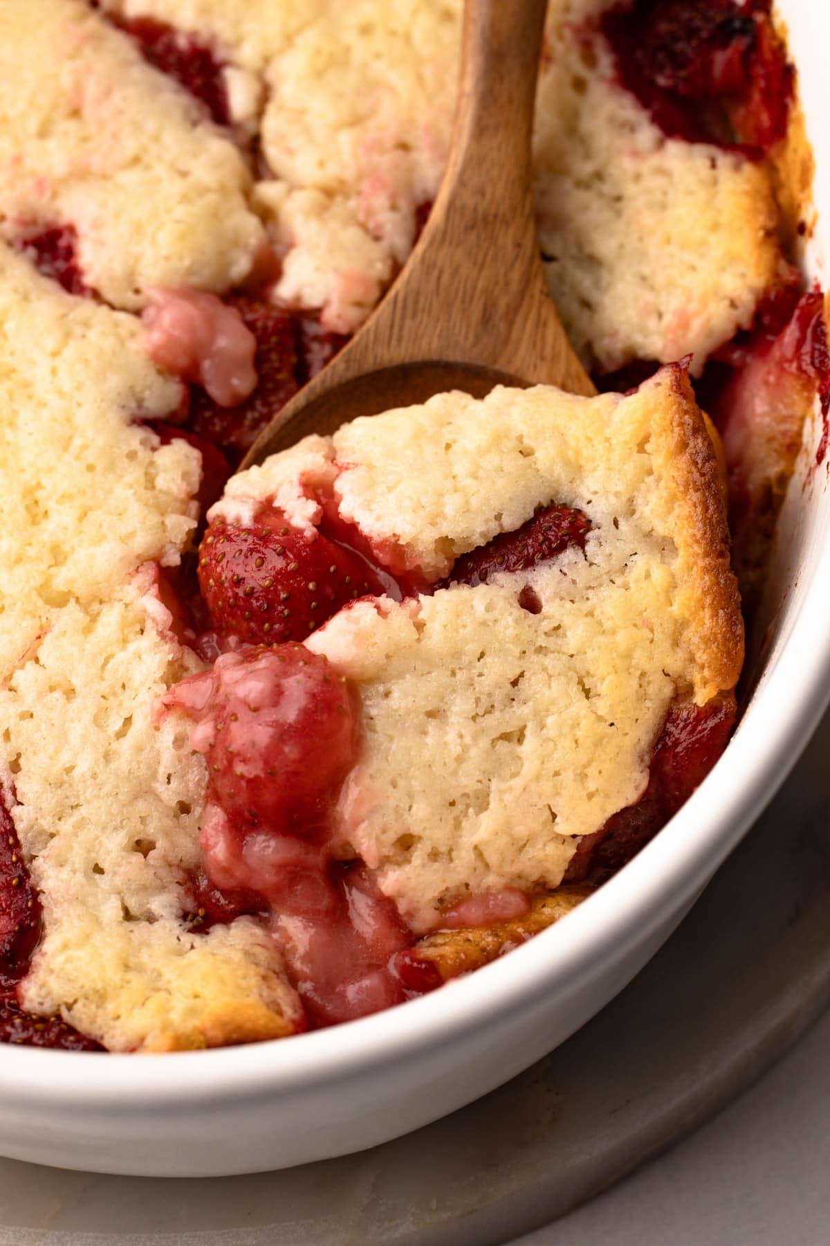 A scoop of strawberry cobbler.