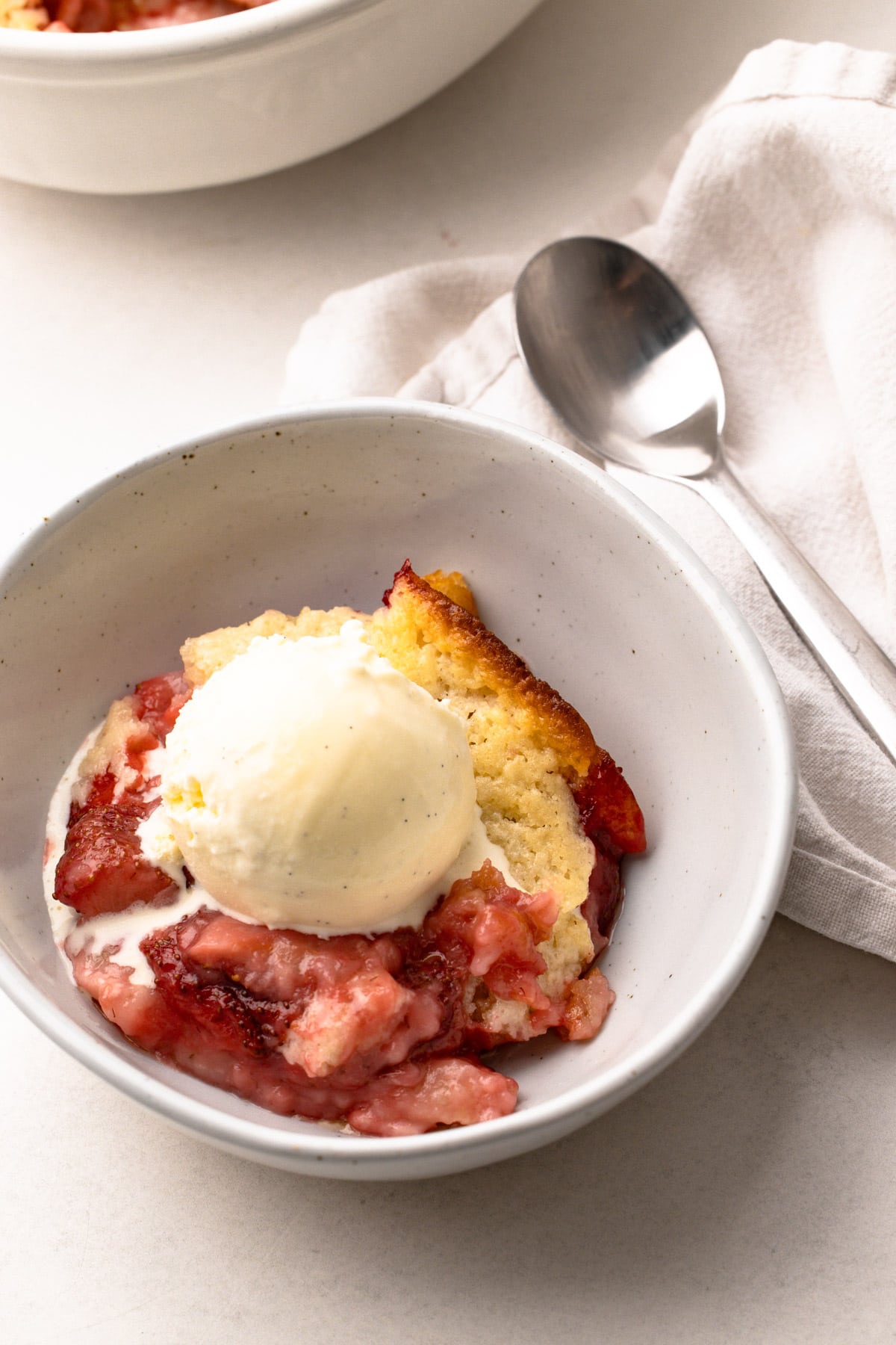 A bowl of strawberry cobbler.