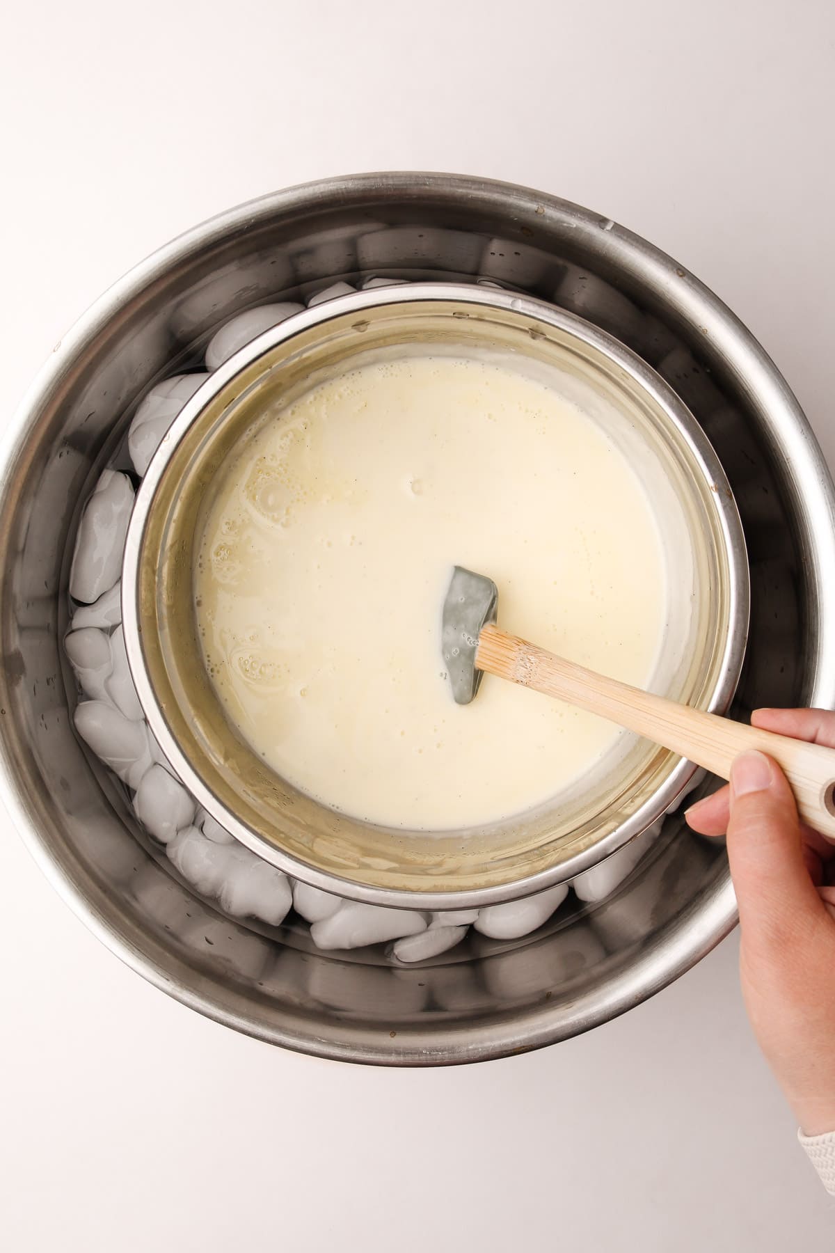 Vanilla bean ice cream custard in an ice bath.