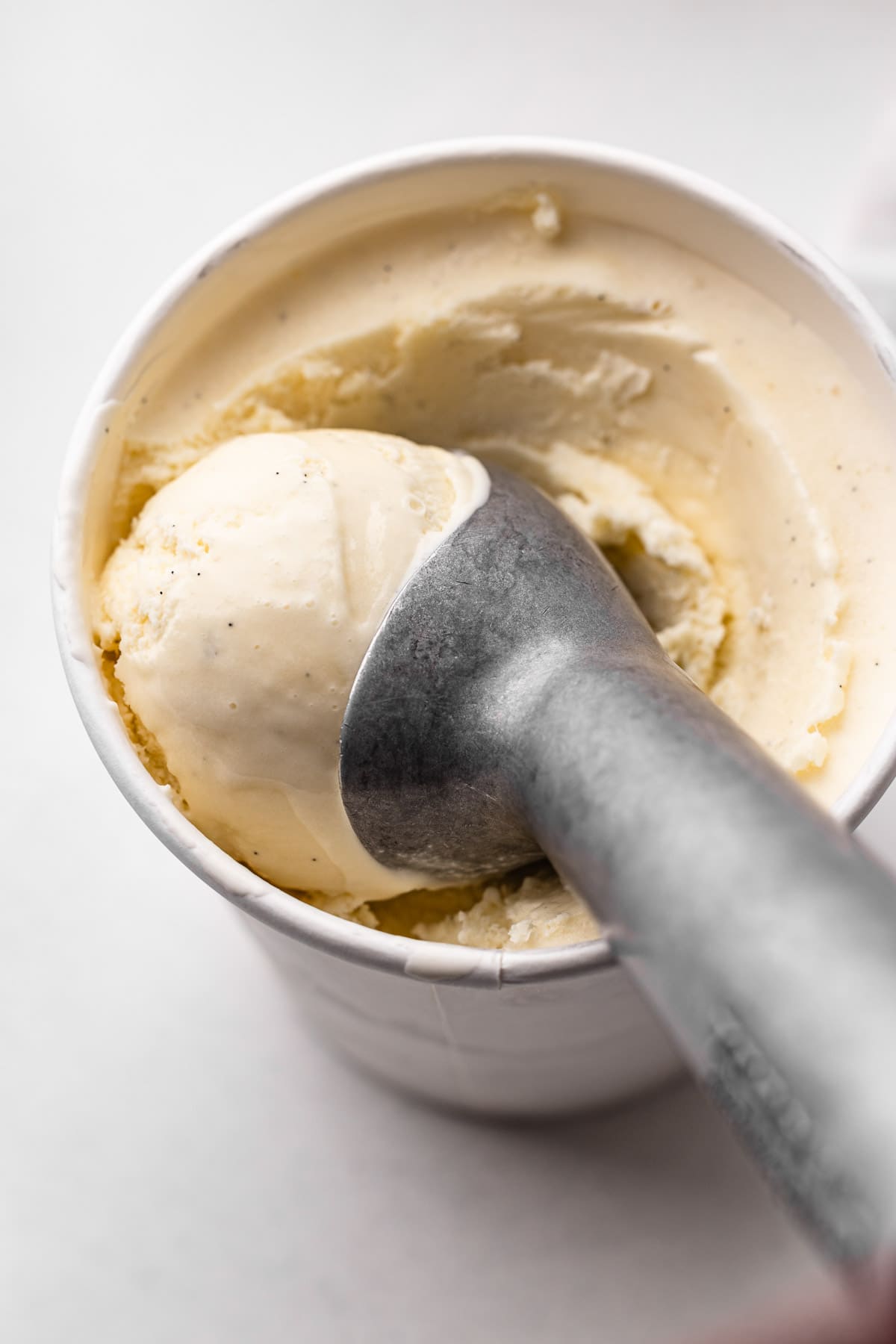 Vanilla bean ice cream in pint containers.