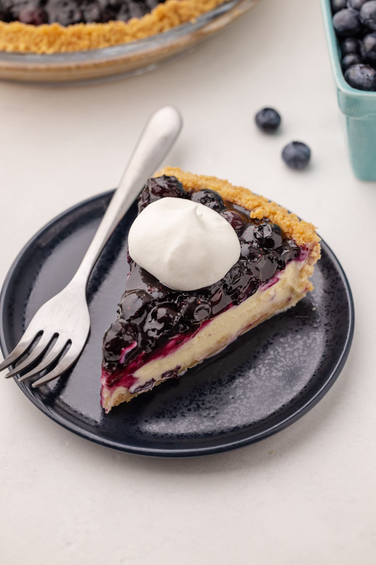 A slice of blueberry cream cheese pie.