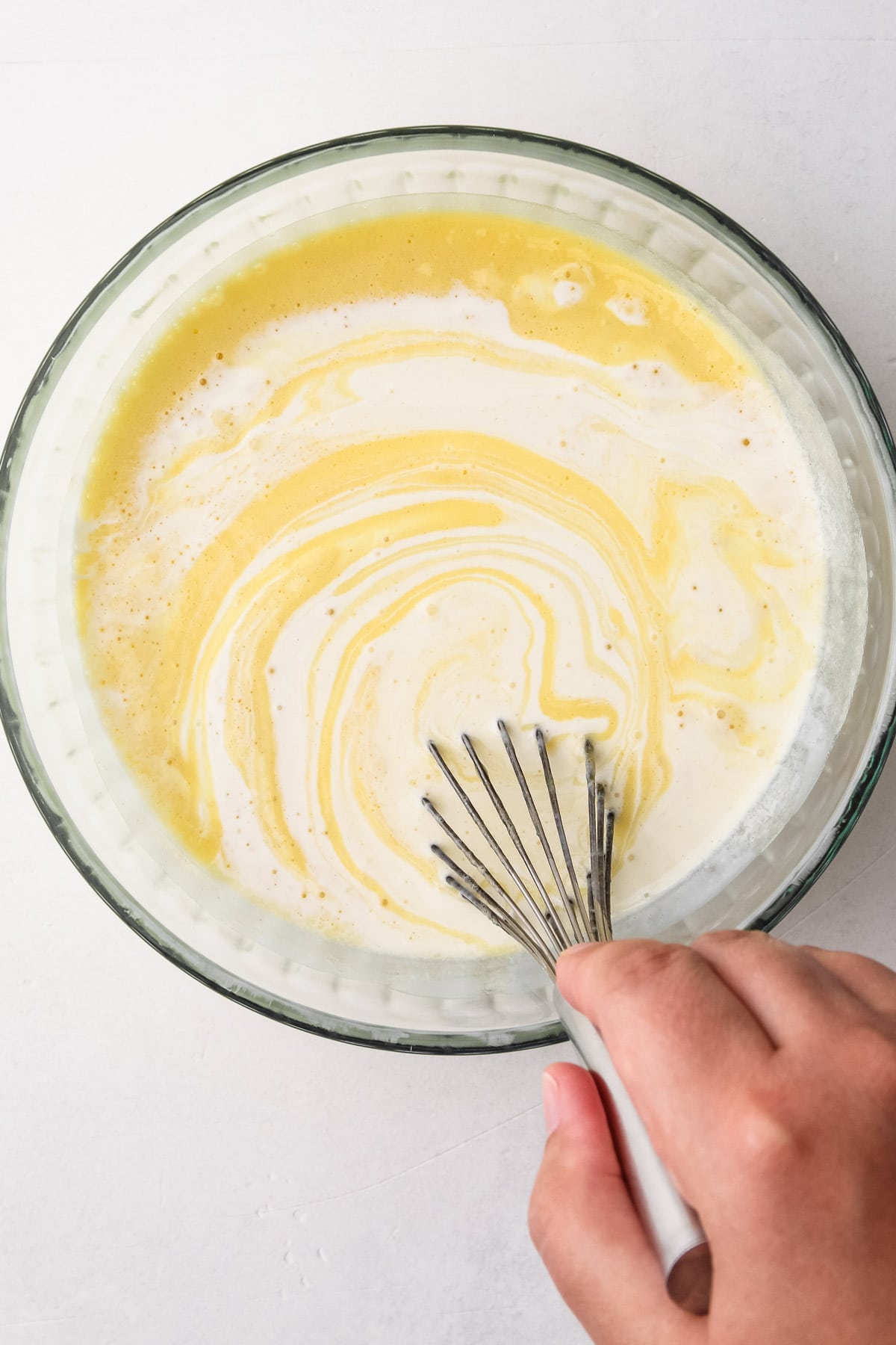 Stirring together custard ice cream.