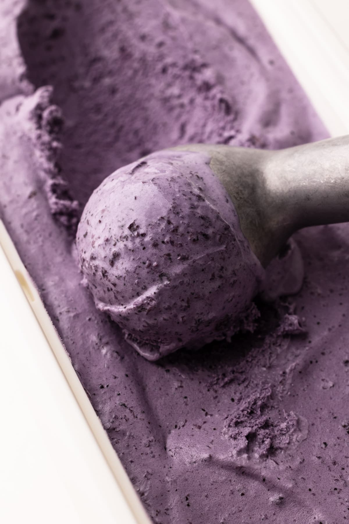 A scoop of blueberry ice cream.