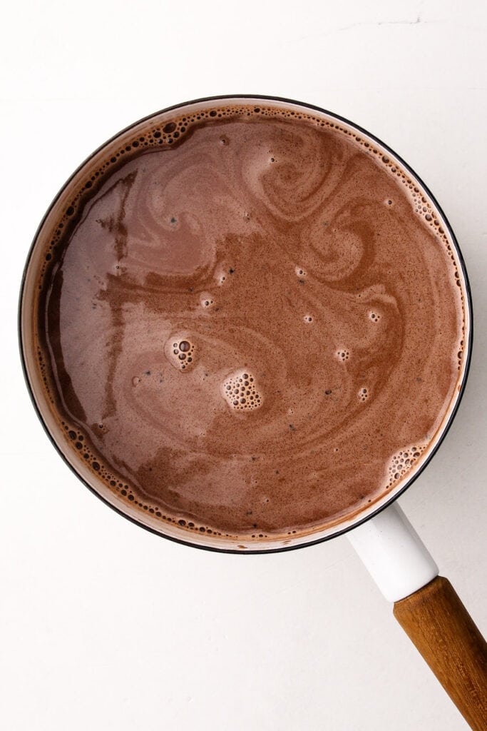 A pot with chocolate ice cream base.