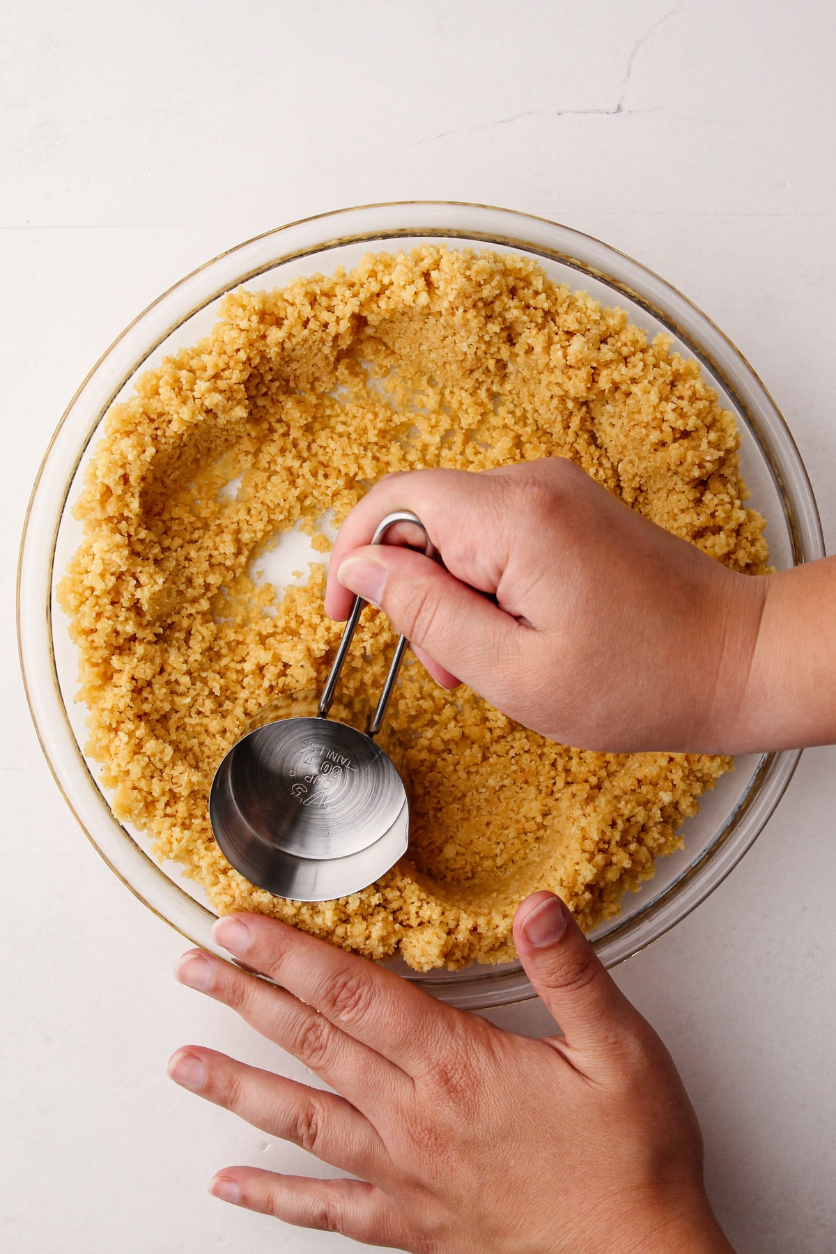 Making a shortbread cookie crust.