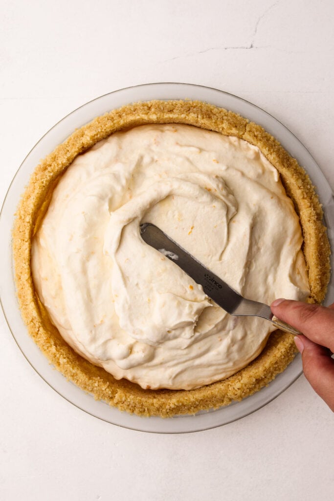 Making a creamsicle pie.