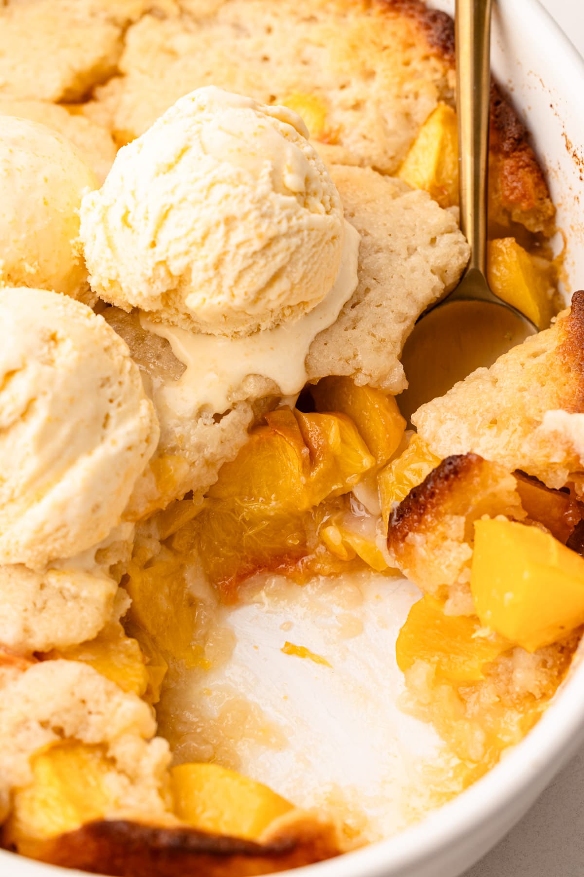 A scoop of peach cobbler.