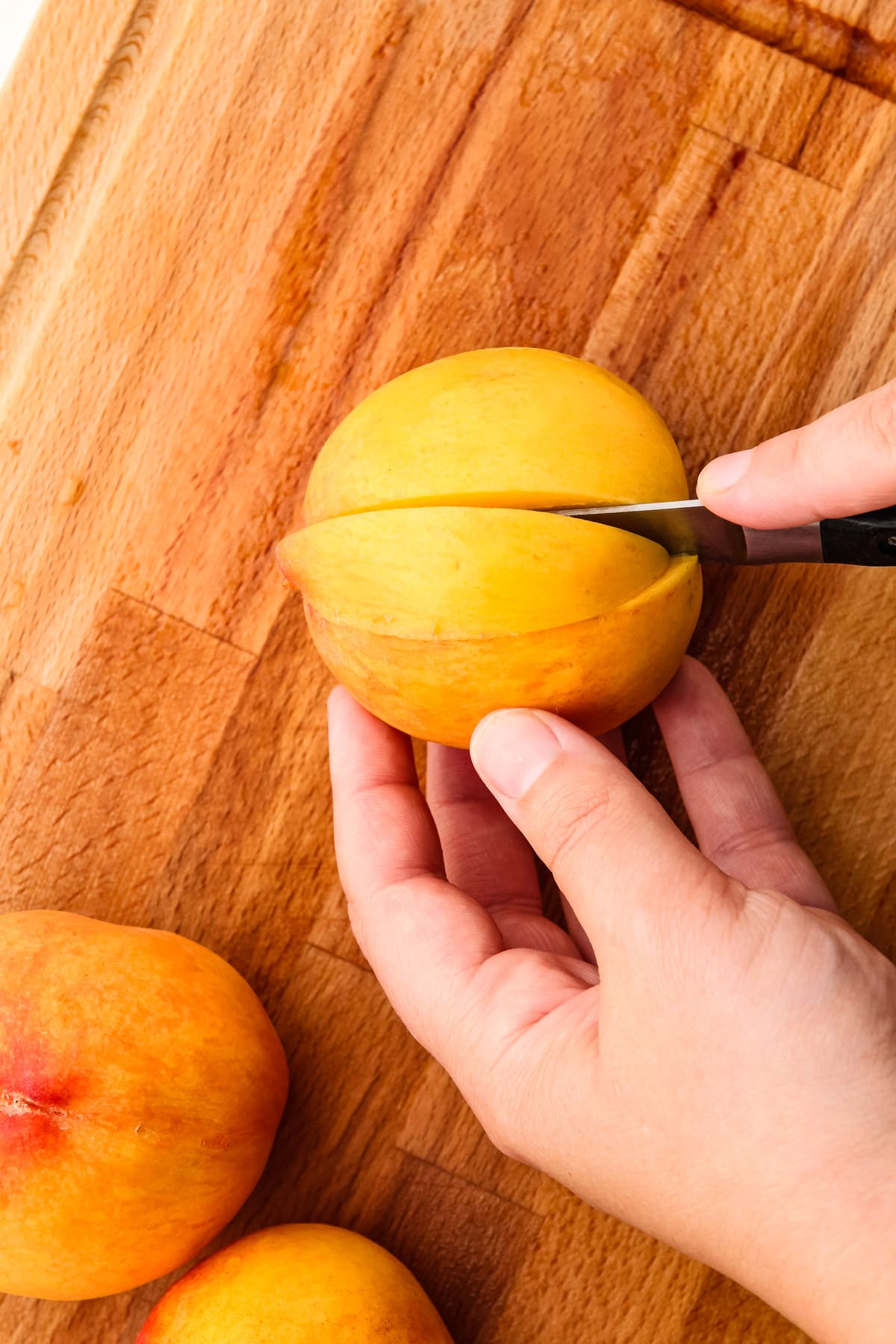 Slicing peaches.