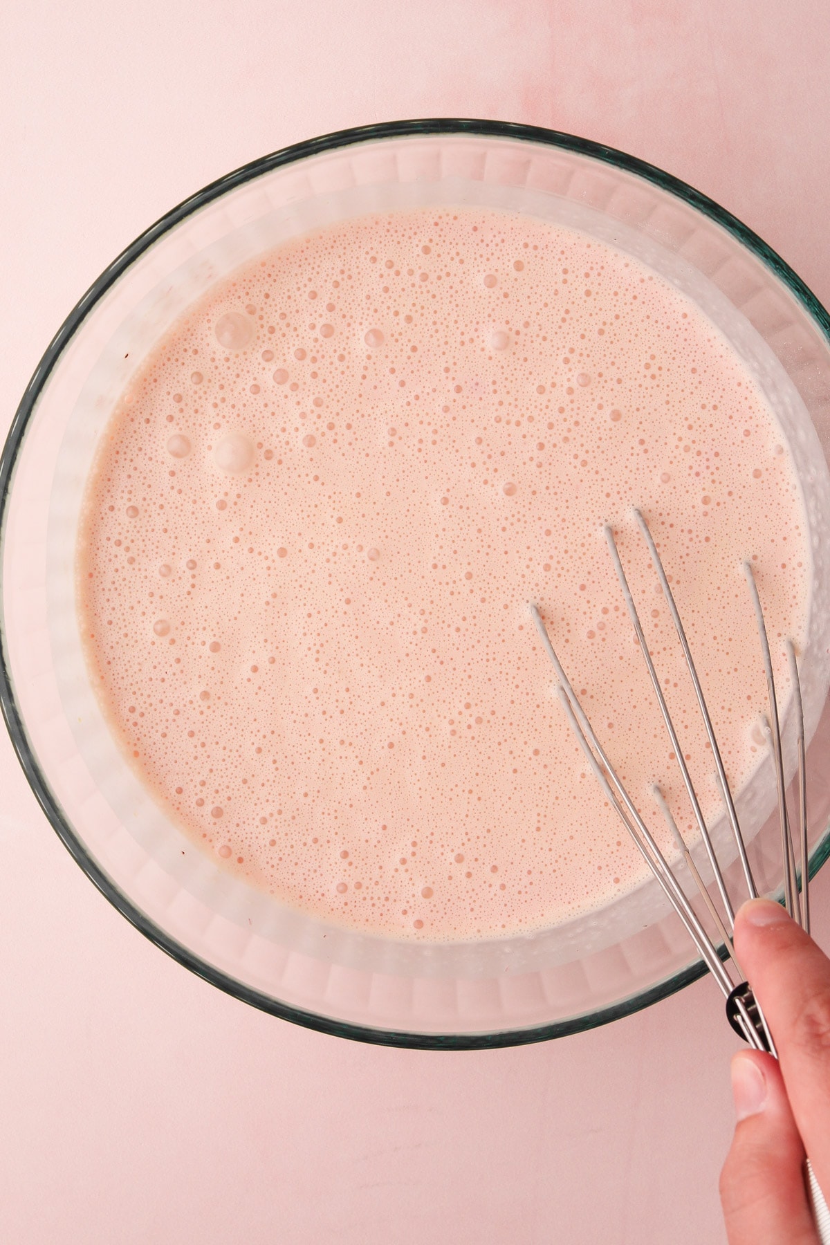 Making strawberry ice cream custard.