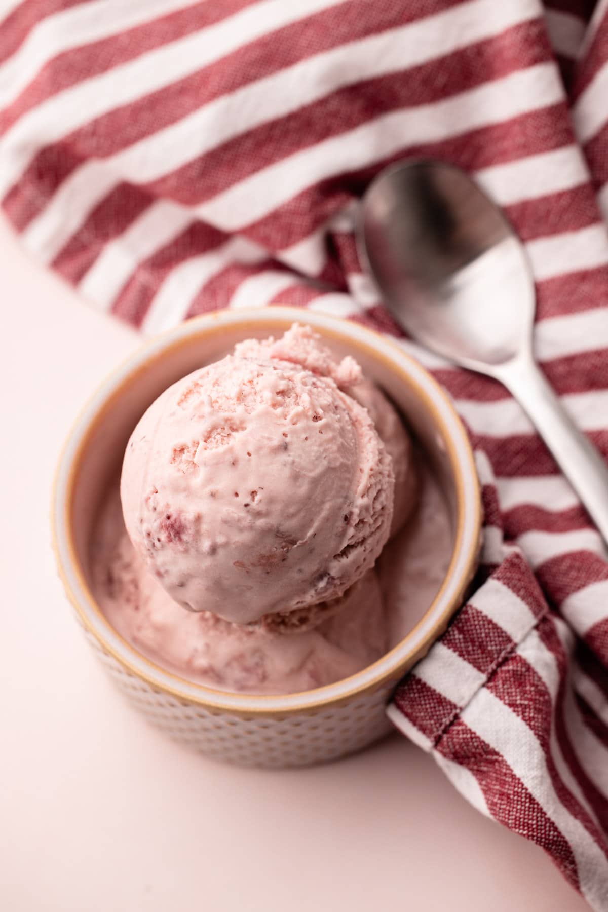 Strawberry ice cream in a bowl.