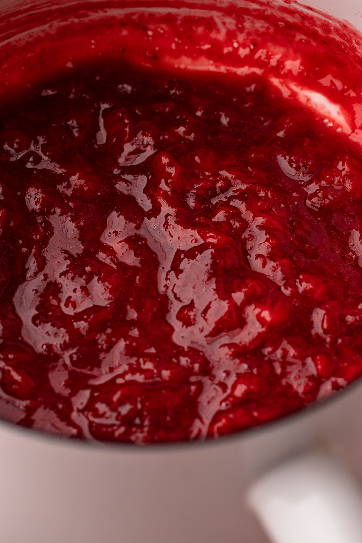 Cooking the strawberries for strawberry ice cream.