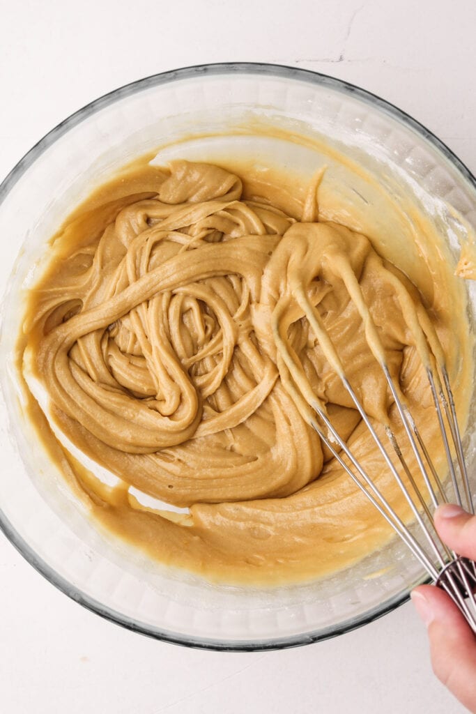 Mixing together waffle batter.