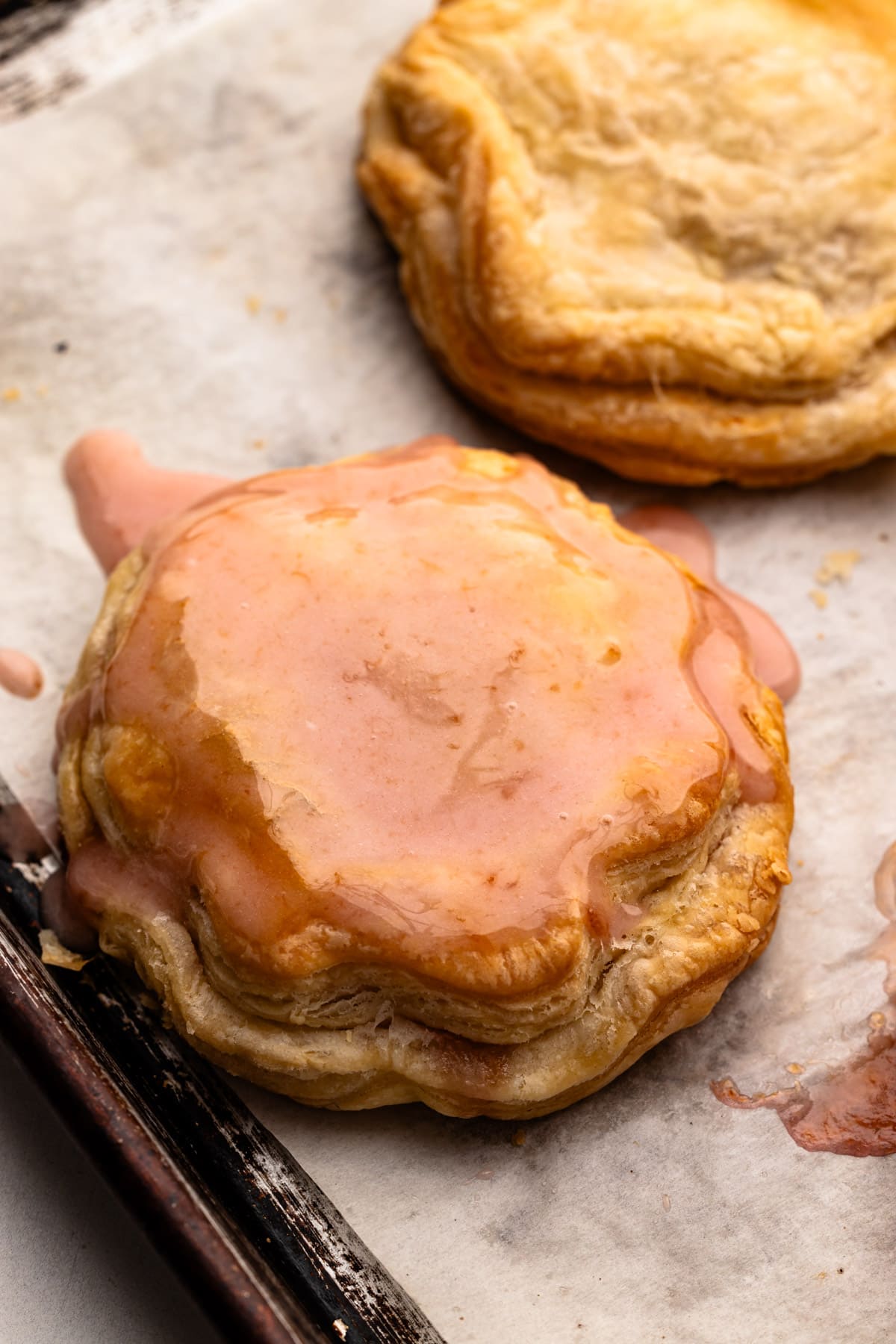 A peach hand pie with a peach glaze.