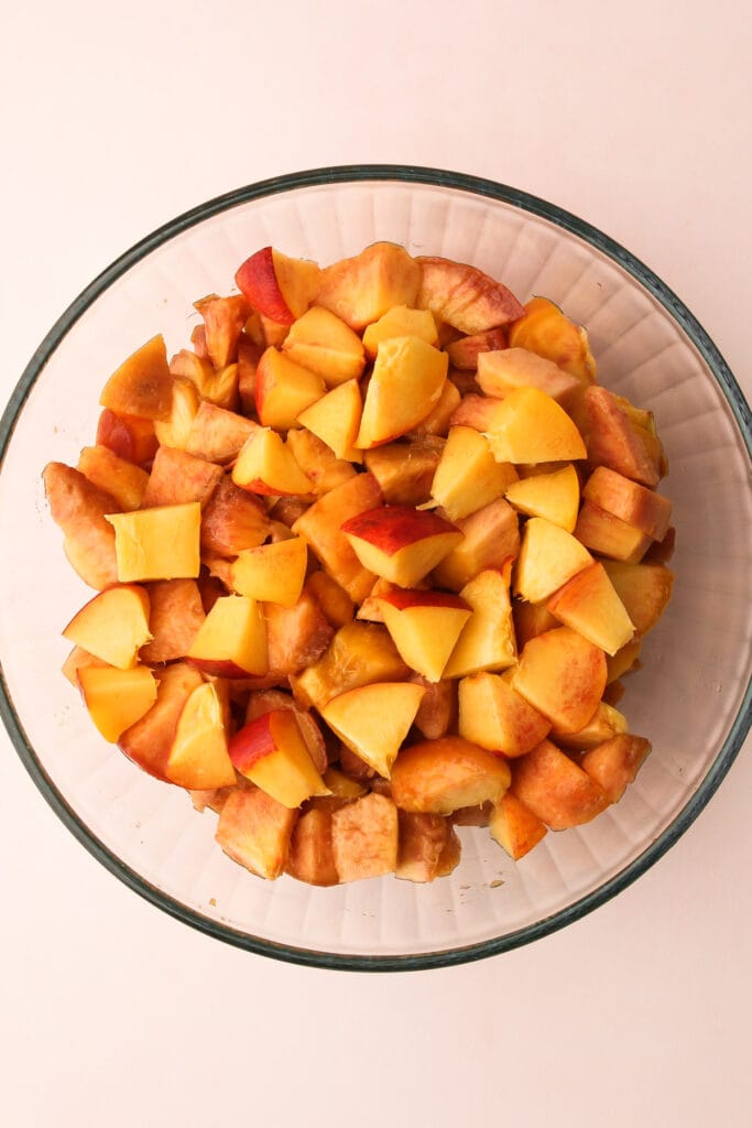 Diced peaches in a bowl.