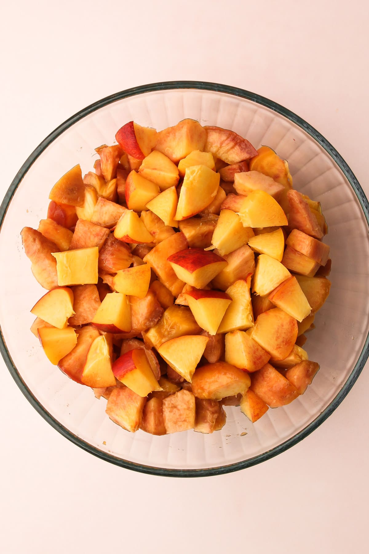 Diced peaches in a bowl.