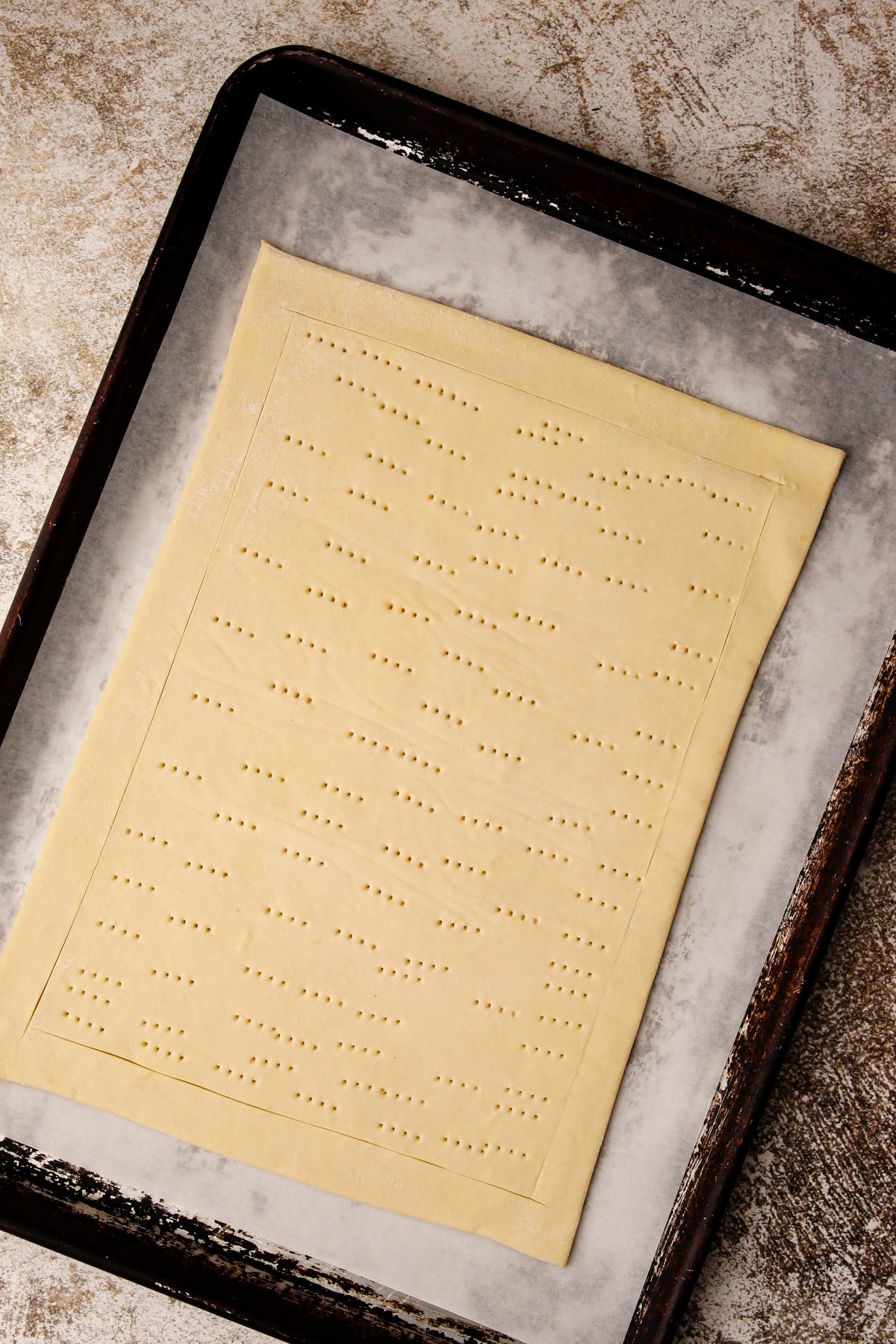 Puff pastry on a sheet pan.