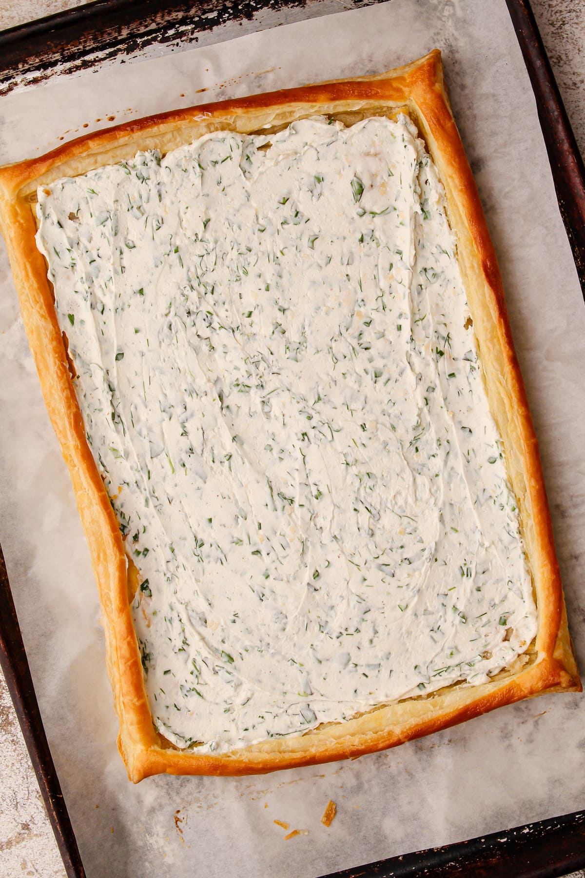 The goat cheese spread on the baked puff pastry shell.