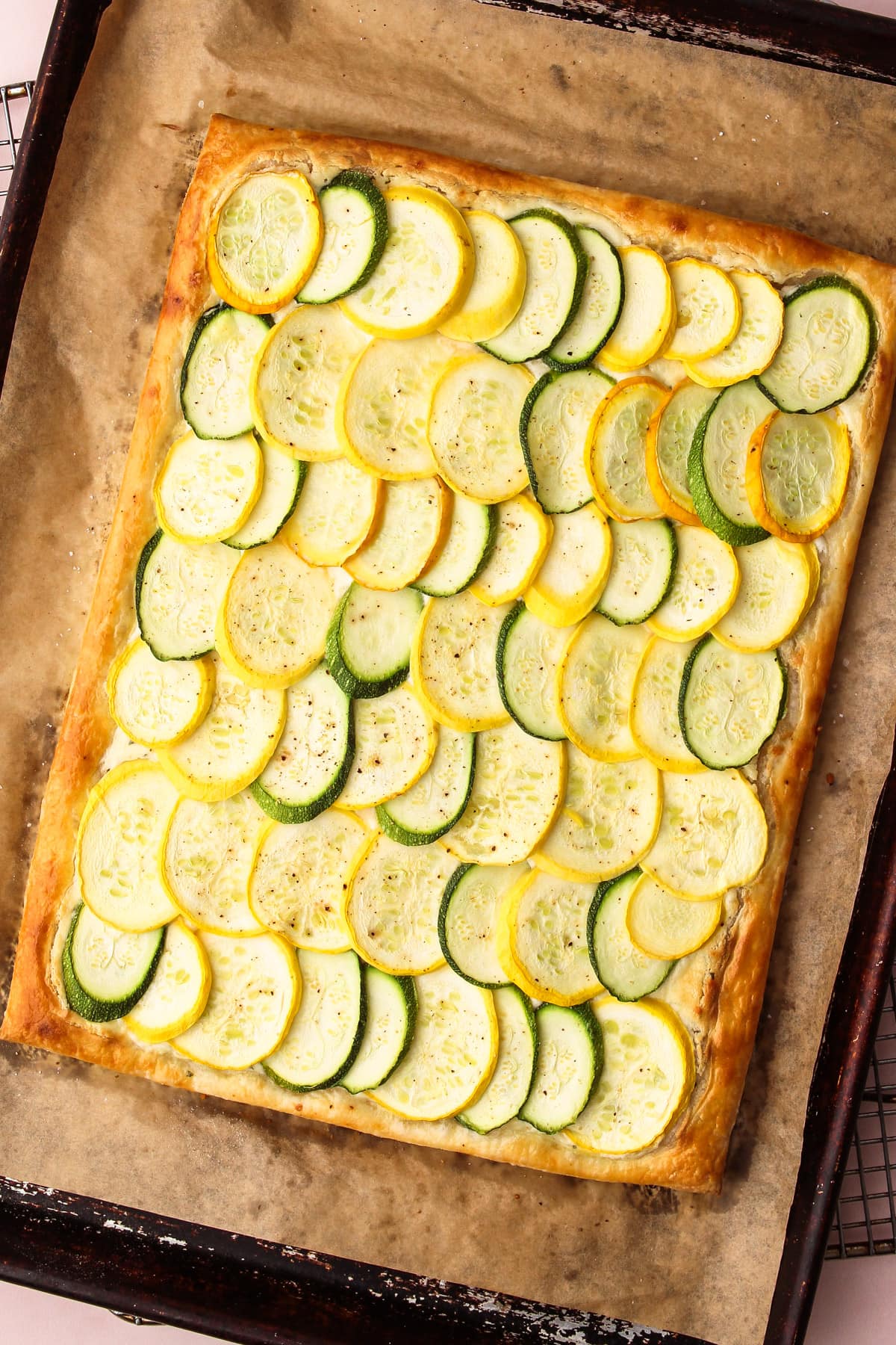 A baked puff pastry zucchini tart.